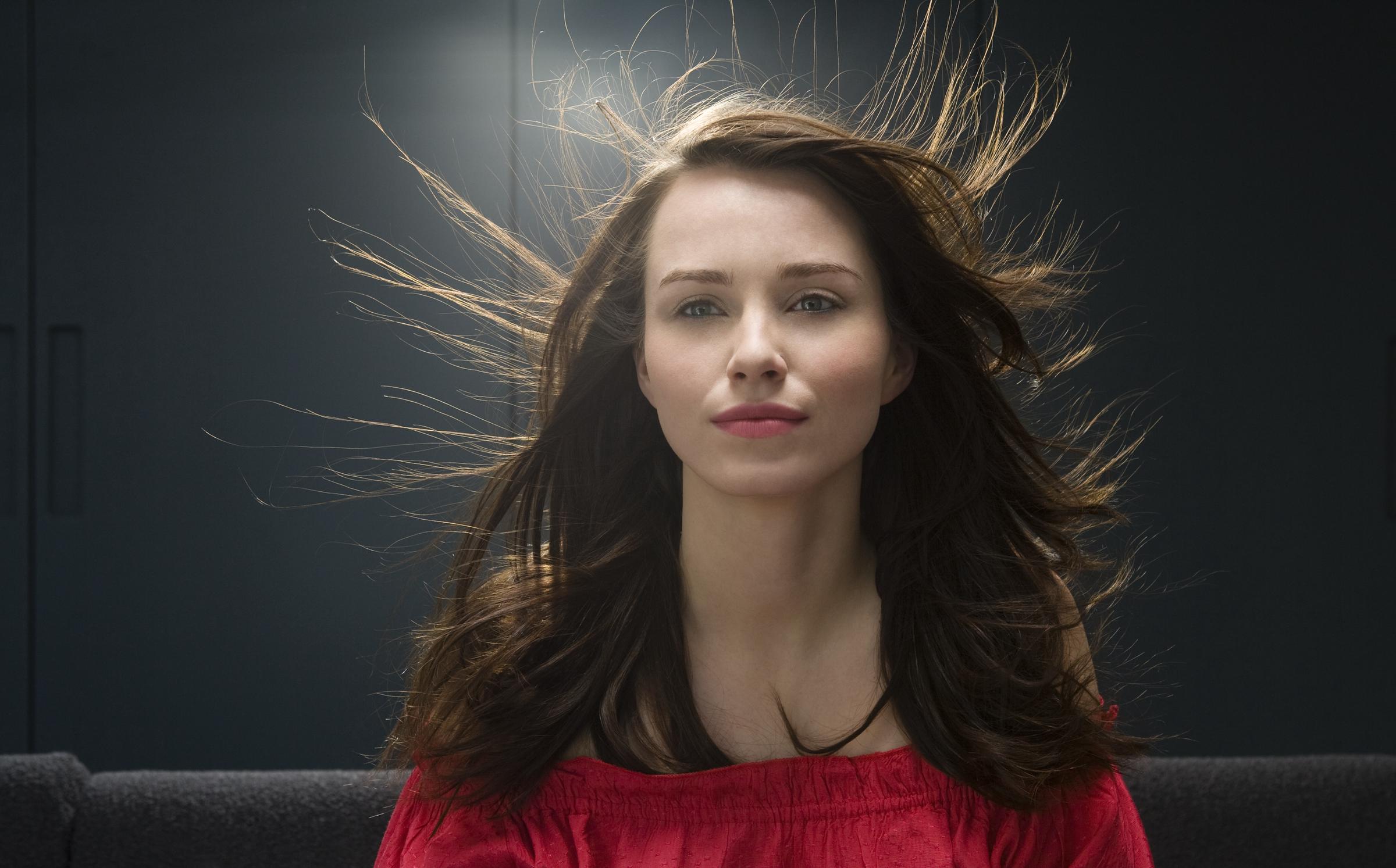 A woman's hair strands rising due to static electricity | Source: Getty Images