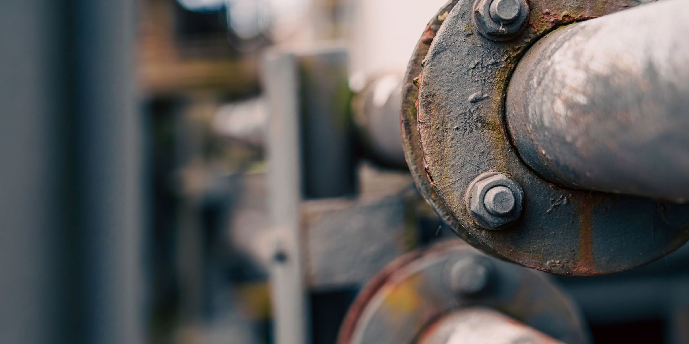 Close-up of industrial metal pipes and bolts | Source: Pexels