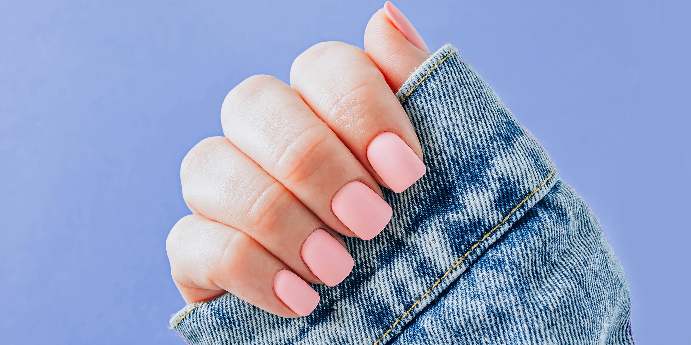 Wide nails with pink polish | Source: Shutterstock