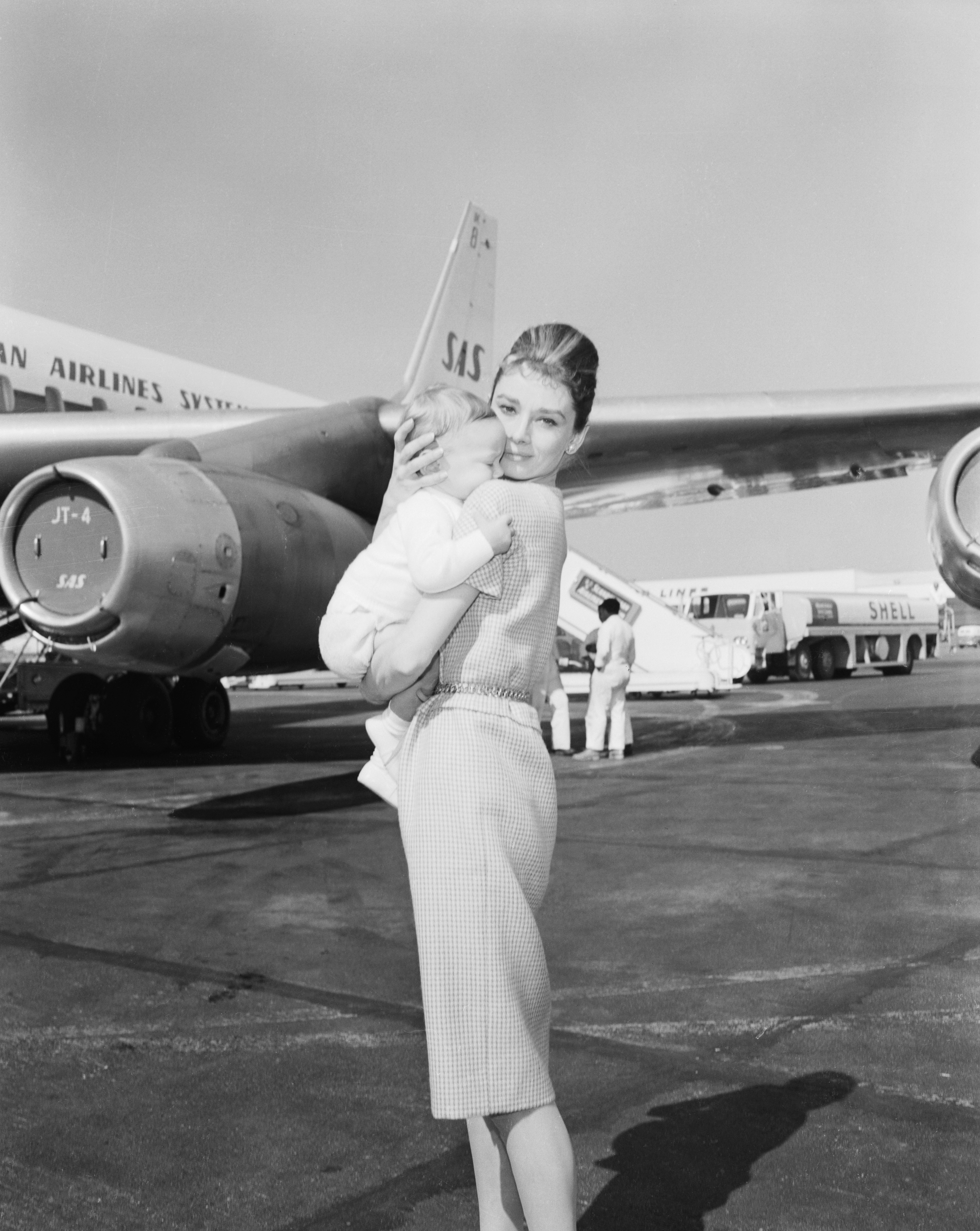 Audrey Hepburn and Sean Hepburn Ferrer at an airport in Rome on February 21, 1961 | Source: Getty Images