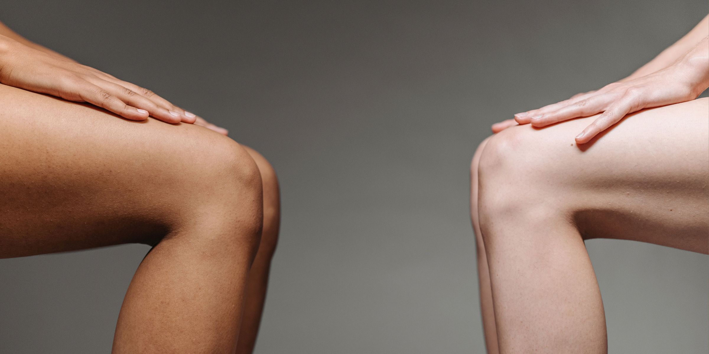 Two sets of legs in a sitting position across from each other | Source: Pexels