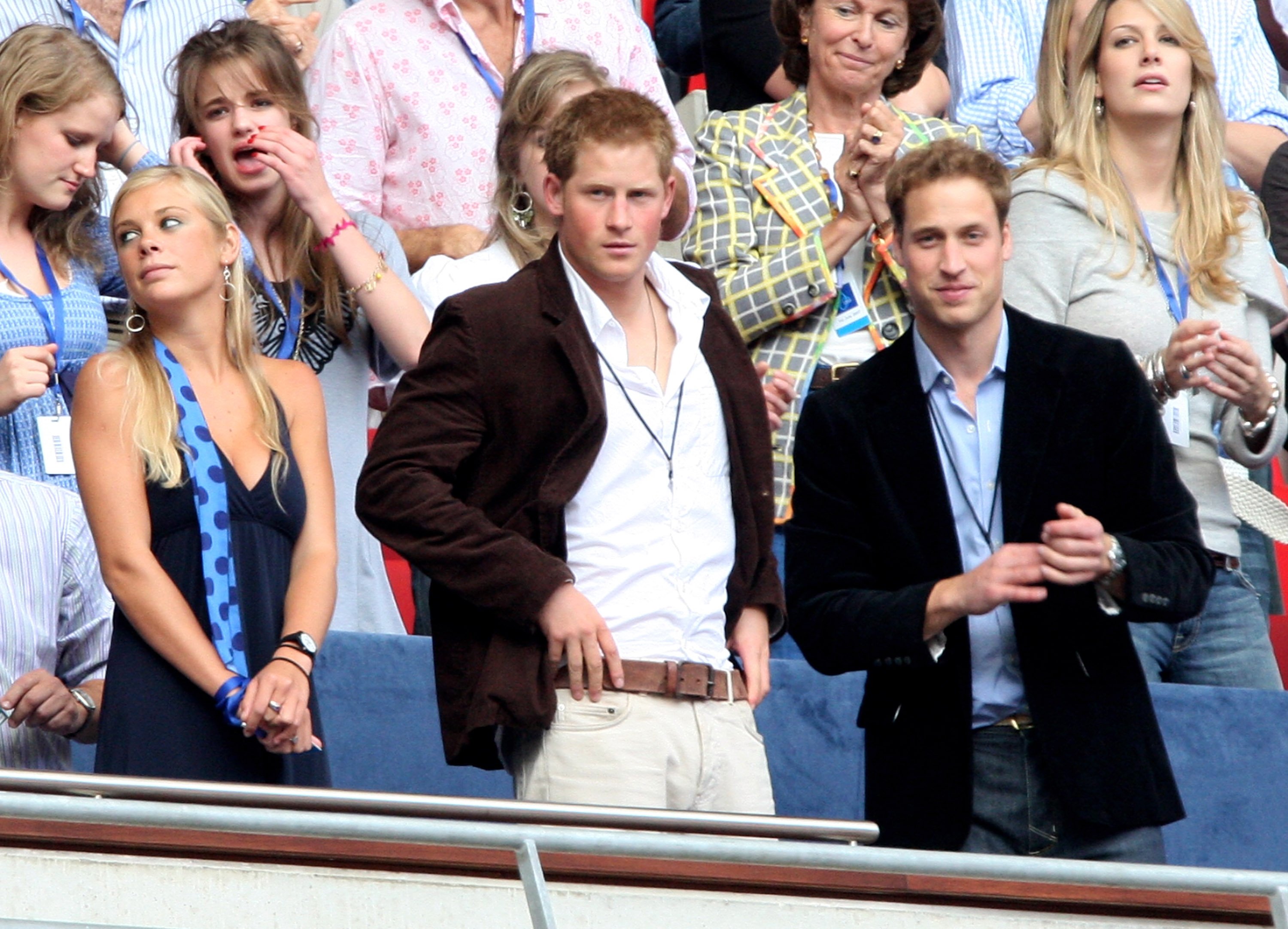 rince William (R) and Prince Harry and guest Chelsy Davy watch the Concert for Diana at Wembley Stadium on July 1, 2007 in London, England. | Source: Getty Images
