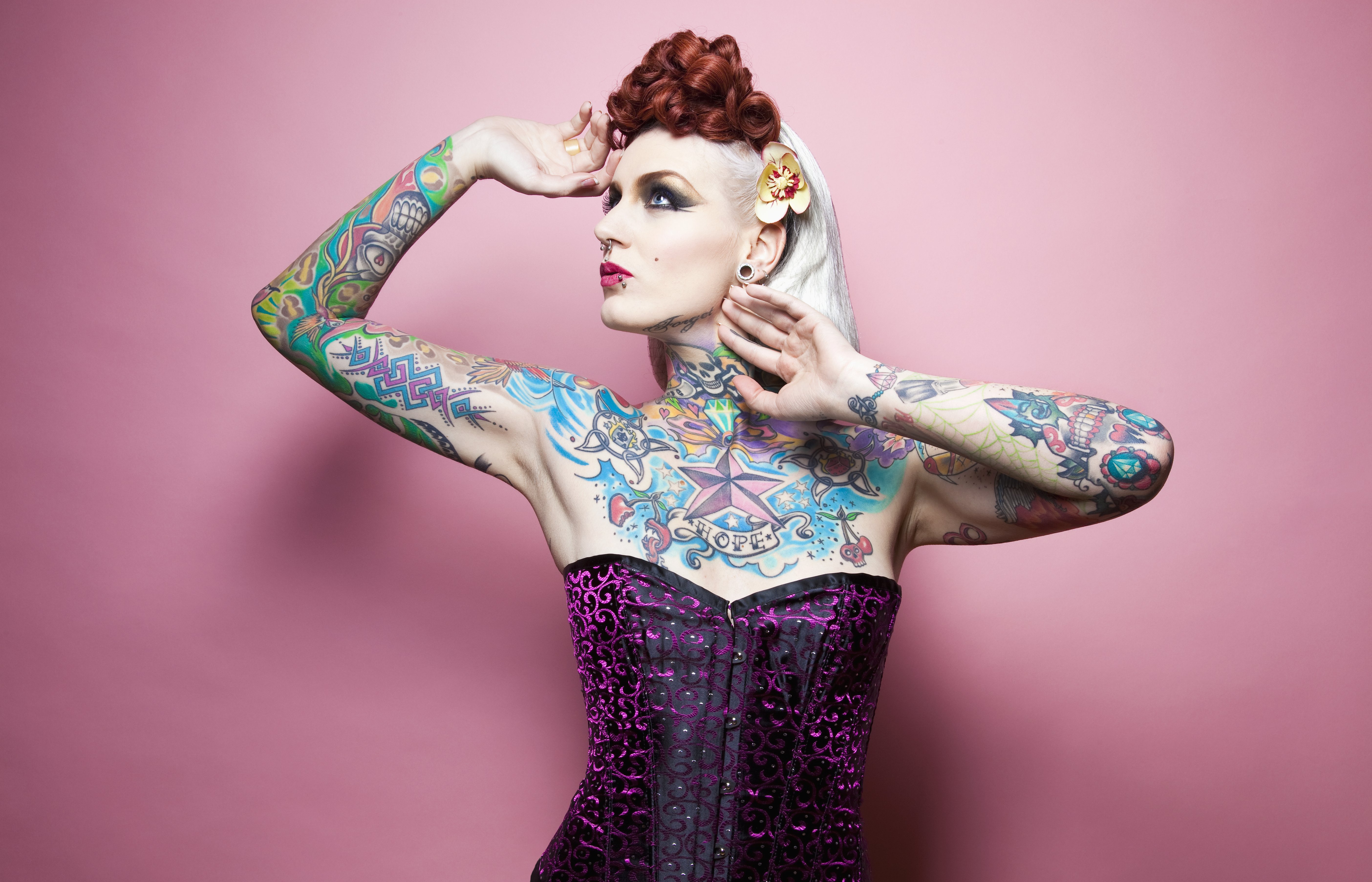 A woman showing off her colorful tattoo | Source: Getty Images