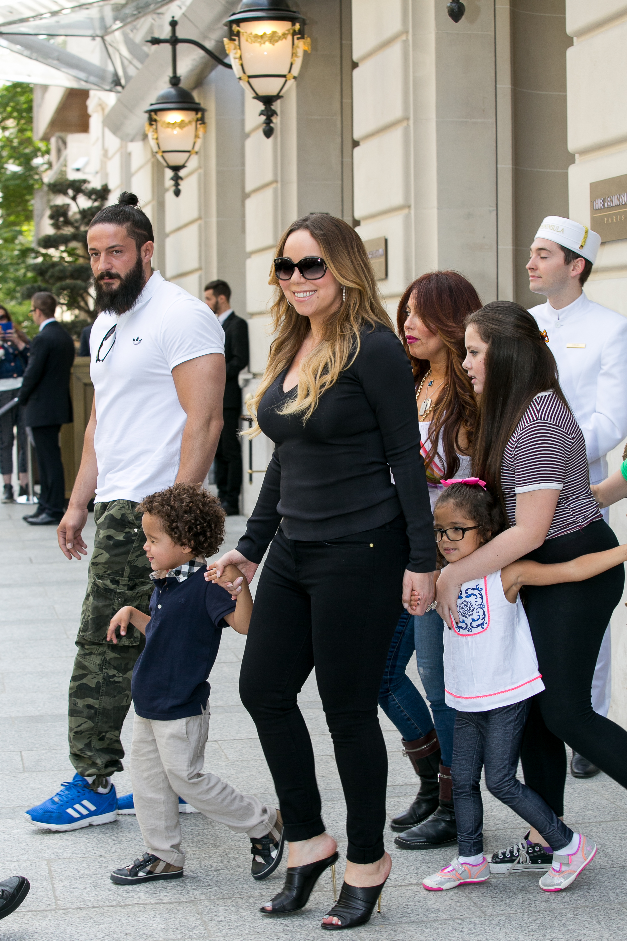 Mariah Carey and her children, Moroccan Scott Cannon and Monroe Cannon, are seen leaving the Peninsula Hotel on June 7, 2015, in Paris, France.