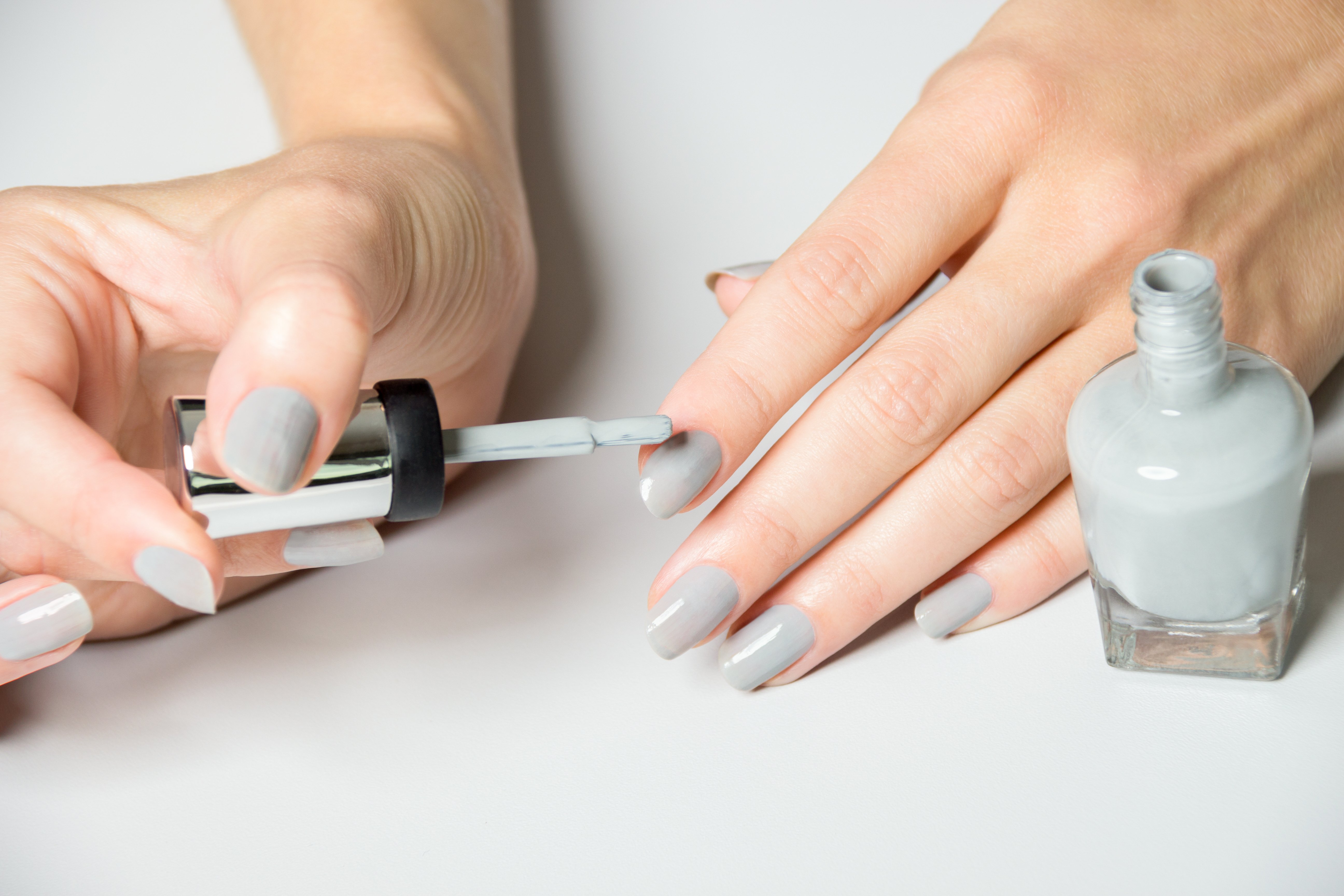 Woman painting her nails | Source: Getty Images