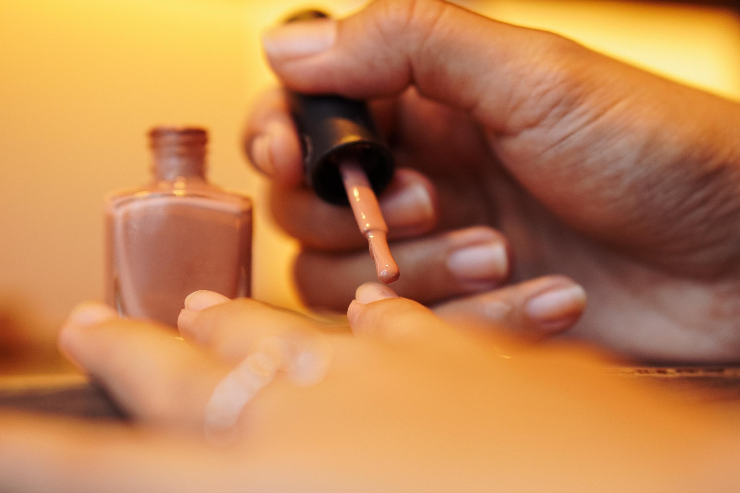 A person applying manicure | Source: Shutterstock
