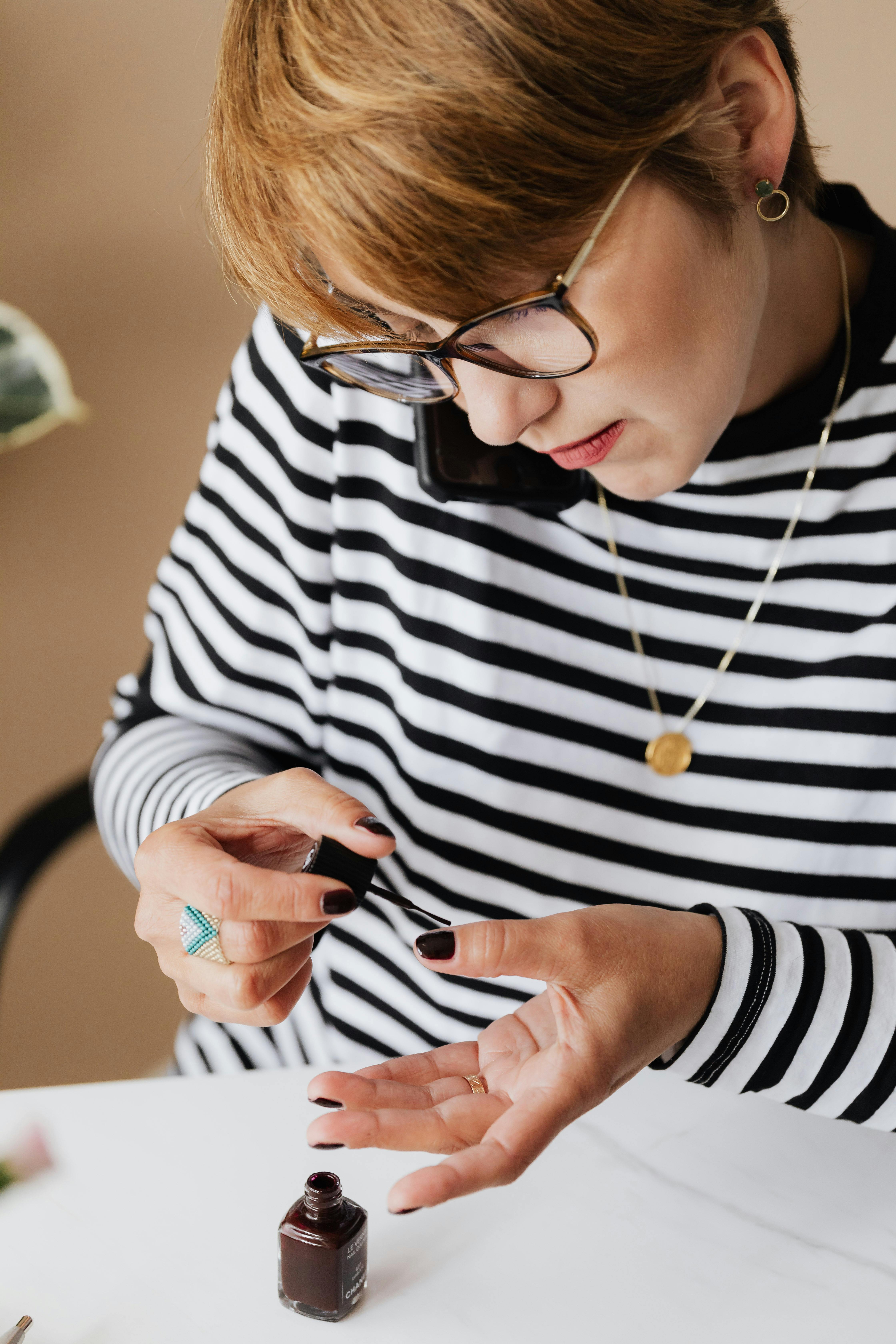 A person applying nail polish | Source: Pexels