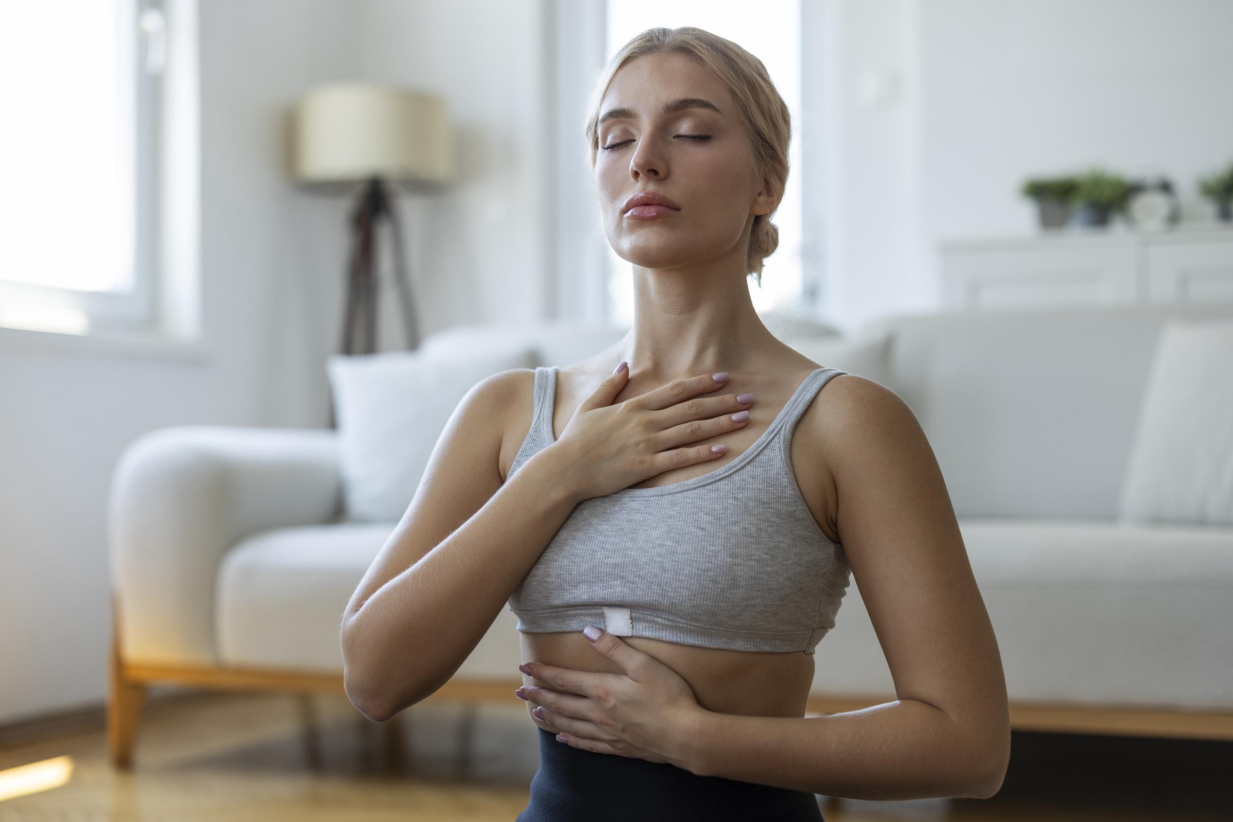 A woman doing a breathing exercise | Source: Getty Images