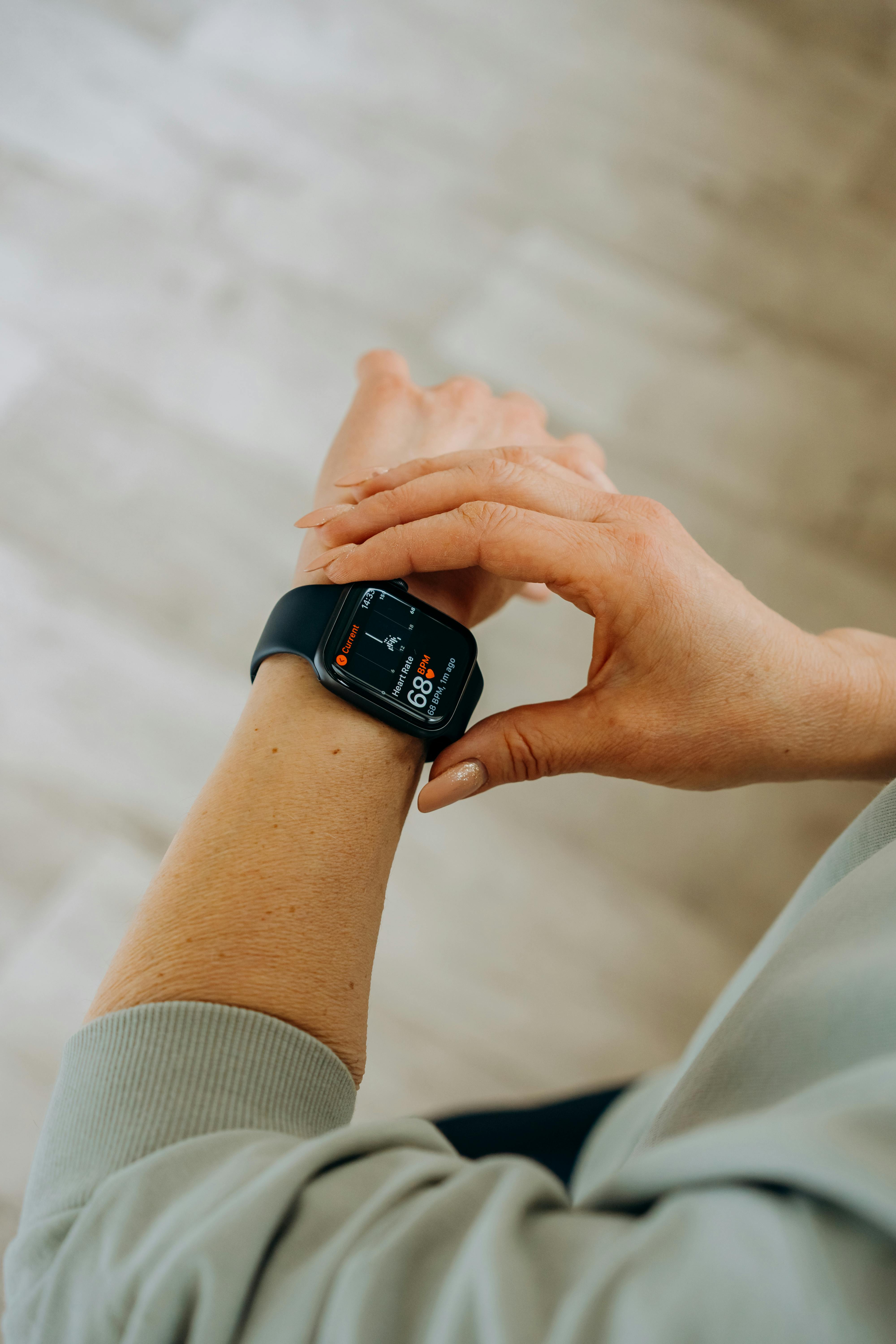 A person checking fitness stats on a smartwatch | Source: Pexels