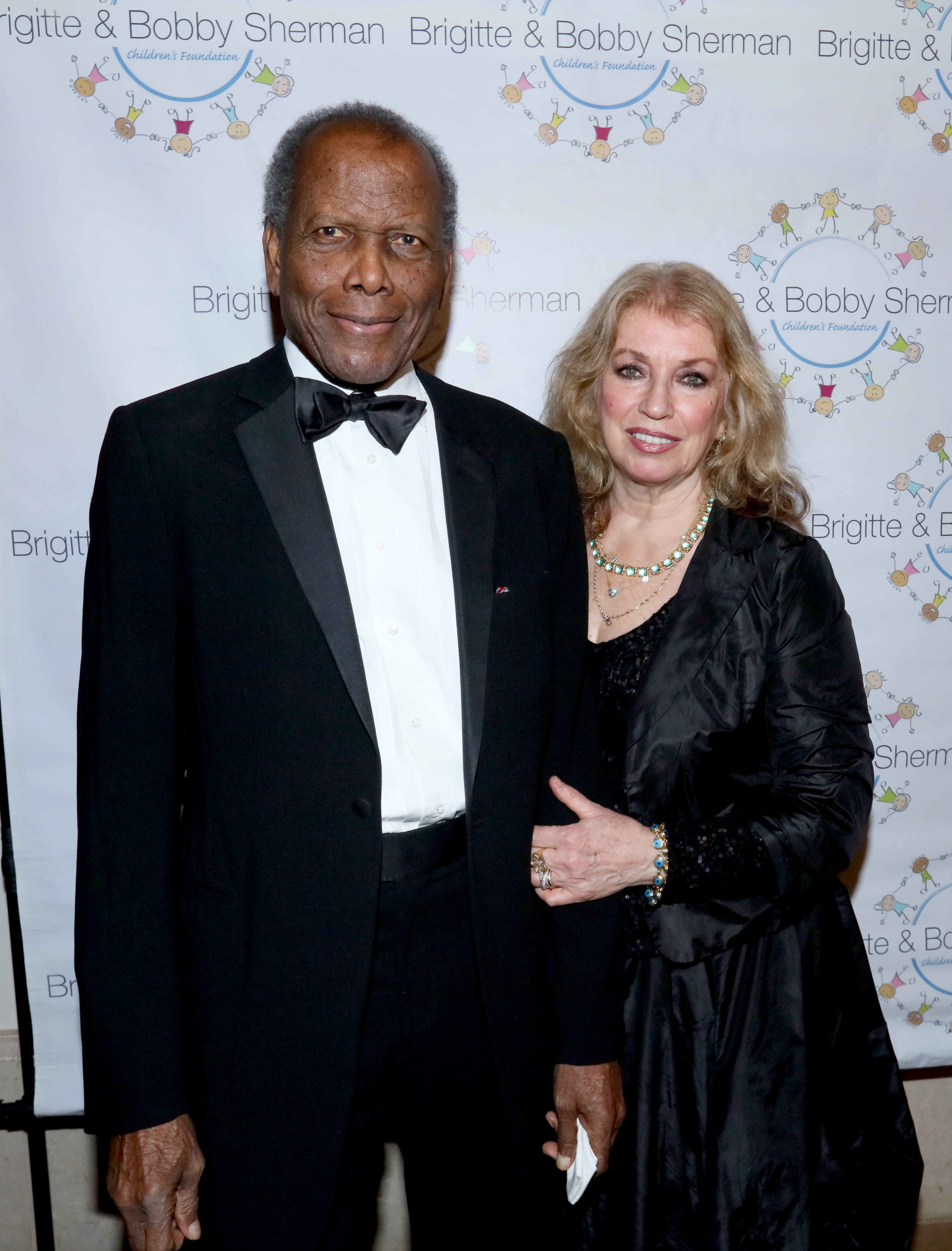 Sidney Poitier and Joanna Shimkus attend the Brigitte and Bobby Sherman Children's Foundation's 6th Annual Christmas Gala and Fundraiser on December 19, 2015, in Beverly Hills, California. | Source: Getty Images