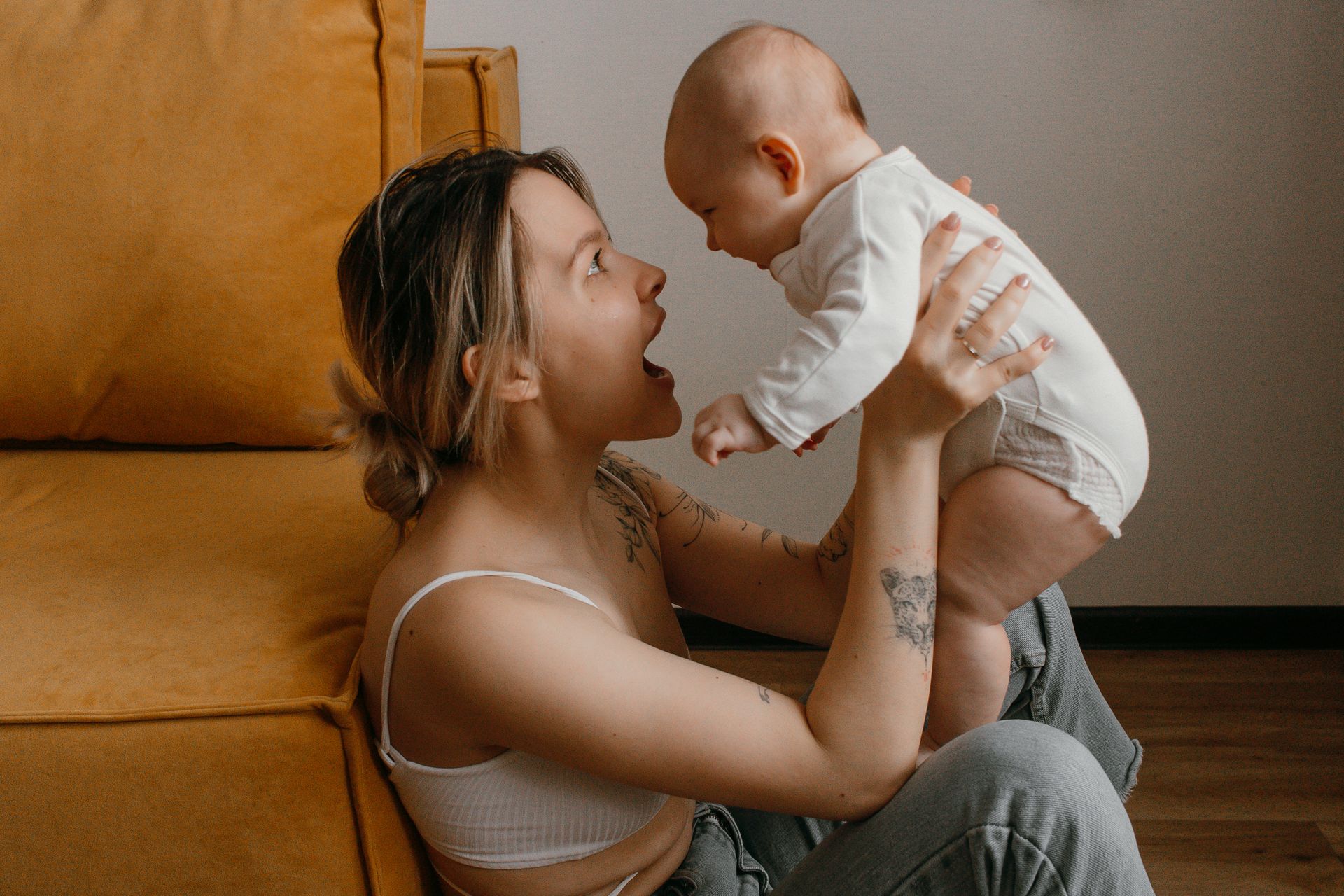 A woman holding her baby | Source: Pexels