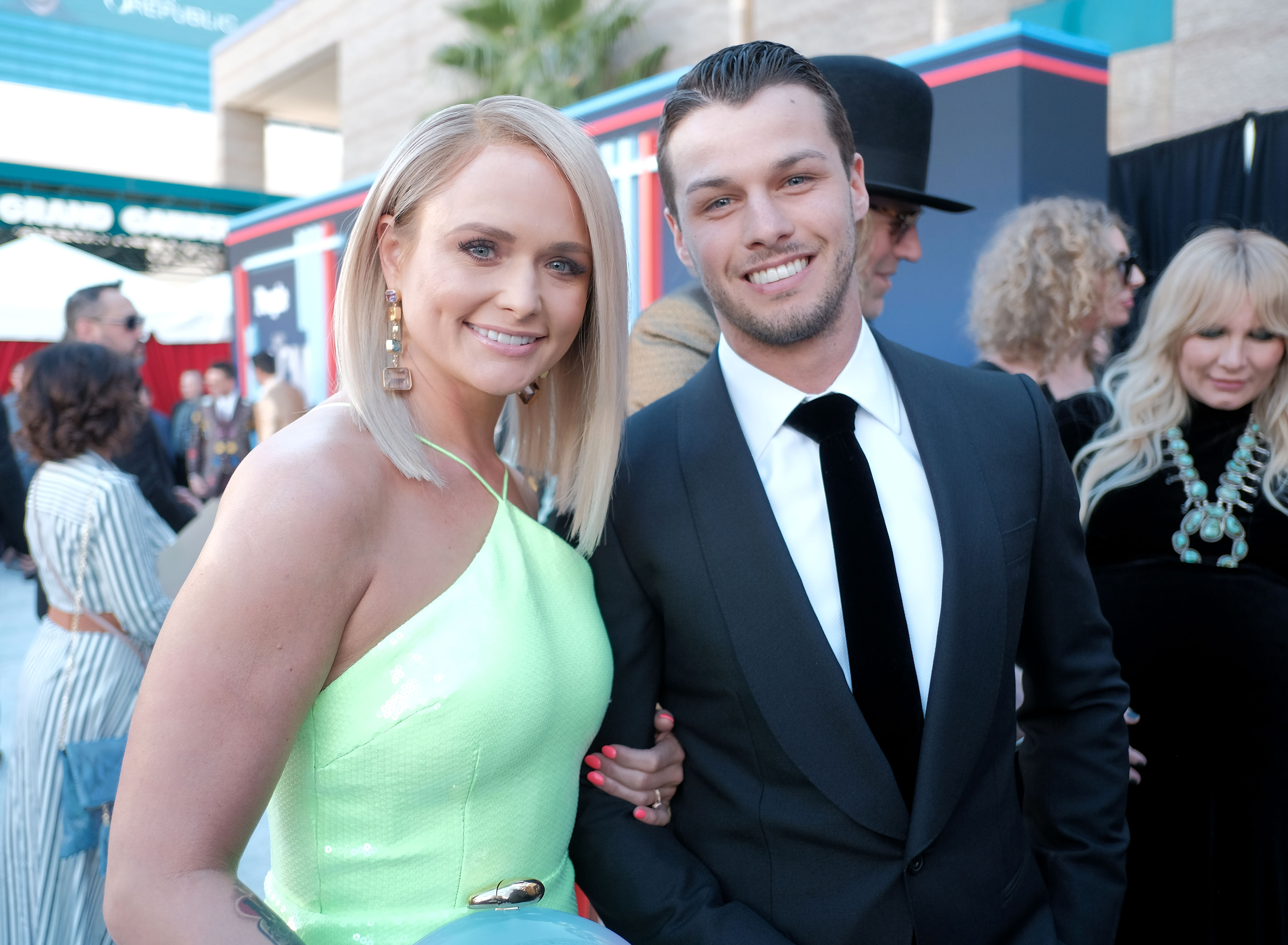 Miranda Lambert and new husband Brendan McLoughlin make their red carpet debut together at the 54th Academy of Country Music Awards in Las Vegas on April 7, 2019. Walking arm in arm just months after their secret January wedding, the glowing newlyweds couldn't hide their happiness as they stepped out publicly for the first time as a married couple. Meeting unexpectedly while McLoughlin was working security in New York City, the former NYPD officer swept the country star off her feet, opening a joyful and devoted new chapter in her life. | Source: Getty Images
