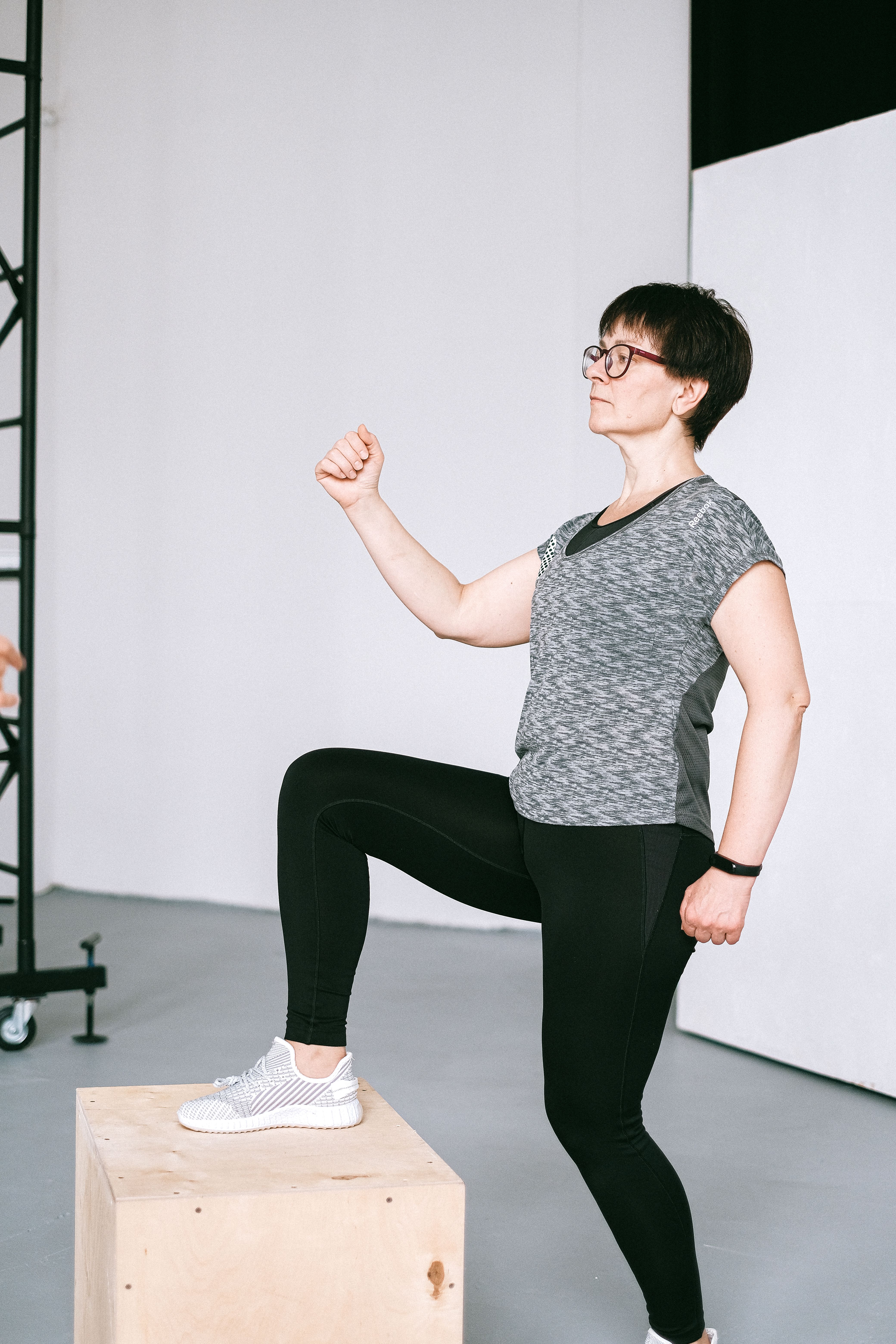 Woman stepping on a block of wood | Source: Pexels