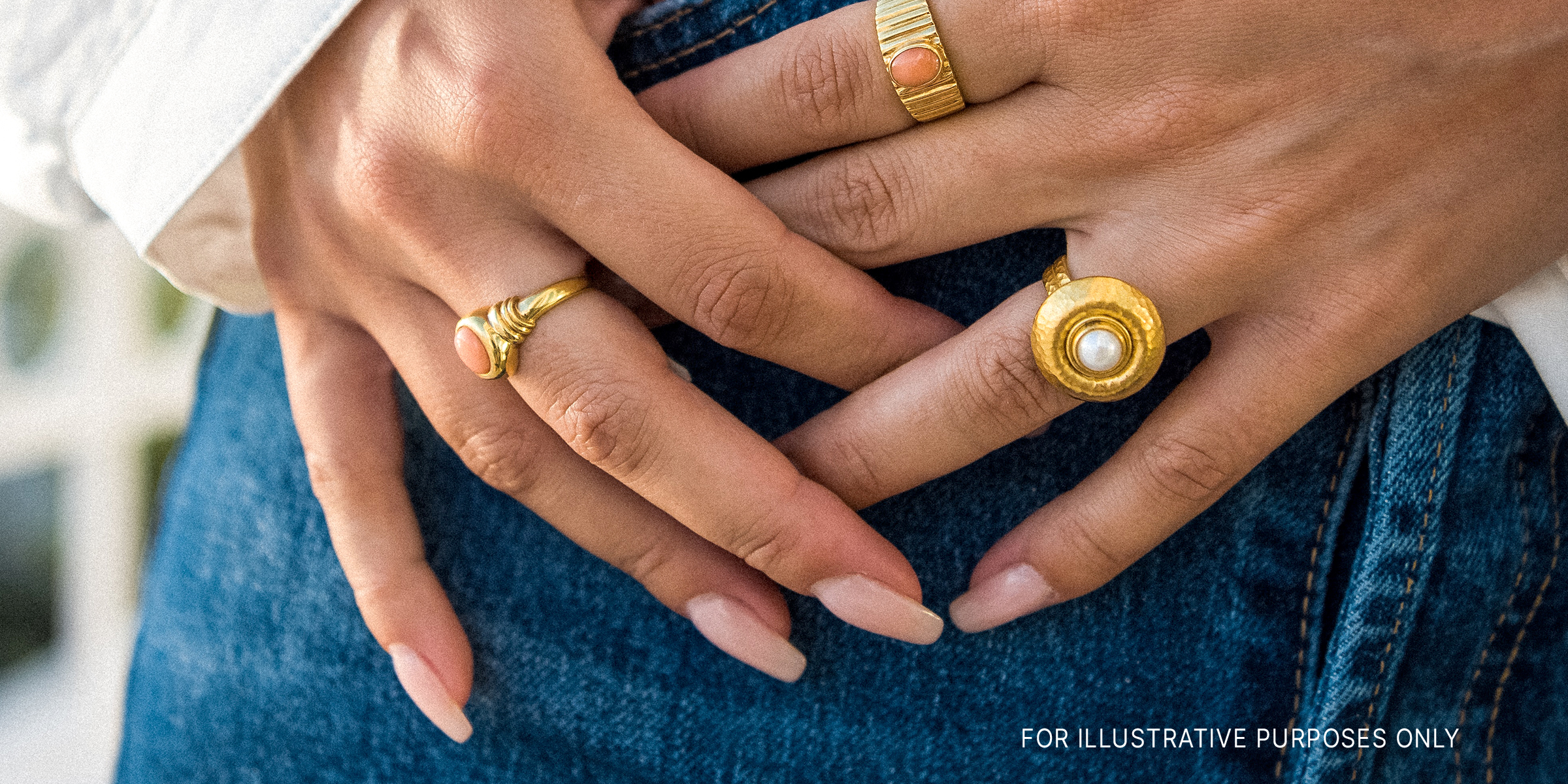 A woman showing her nails and jewelry | Source: Unsplash.com/shotsbytania