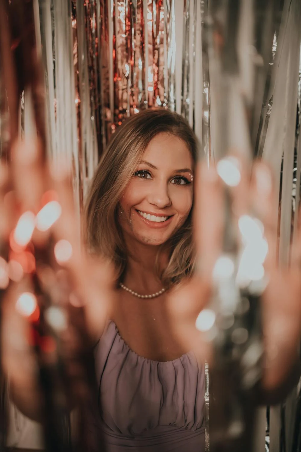 A smiling woman at a party | Source: Pexels