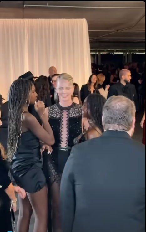 Charlize Theron smiles alongside her daughters, Jackson and August, at the Academy Museum Gala in Los Angeles. While some fans marveled at how much the girls had grown, others questioned their apparent comfort in the spotlight.