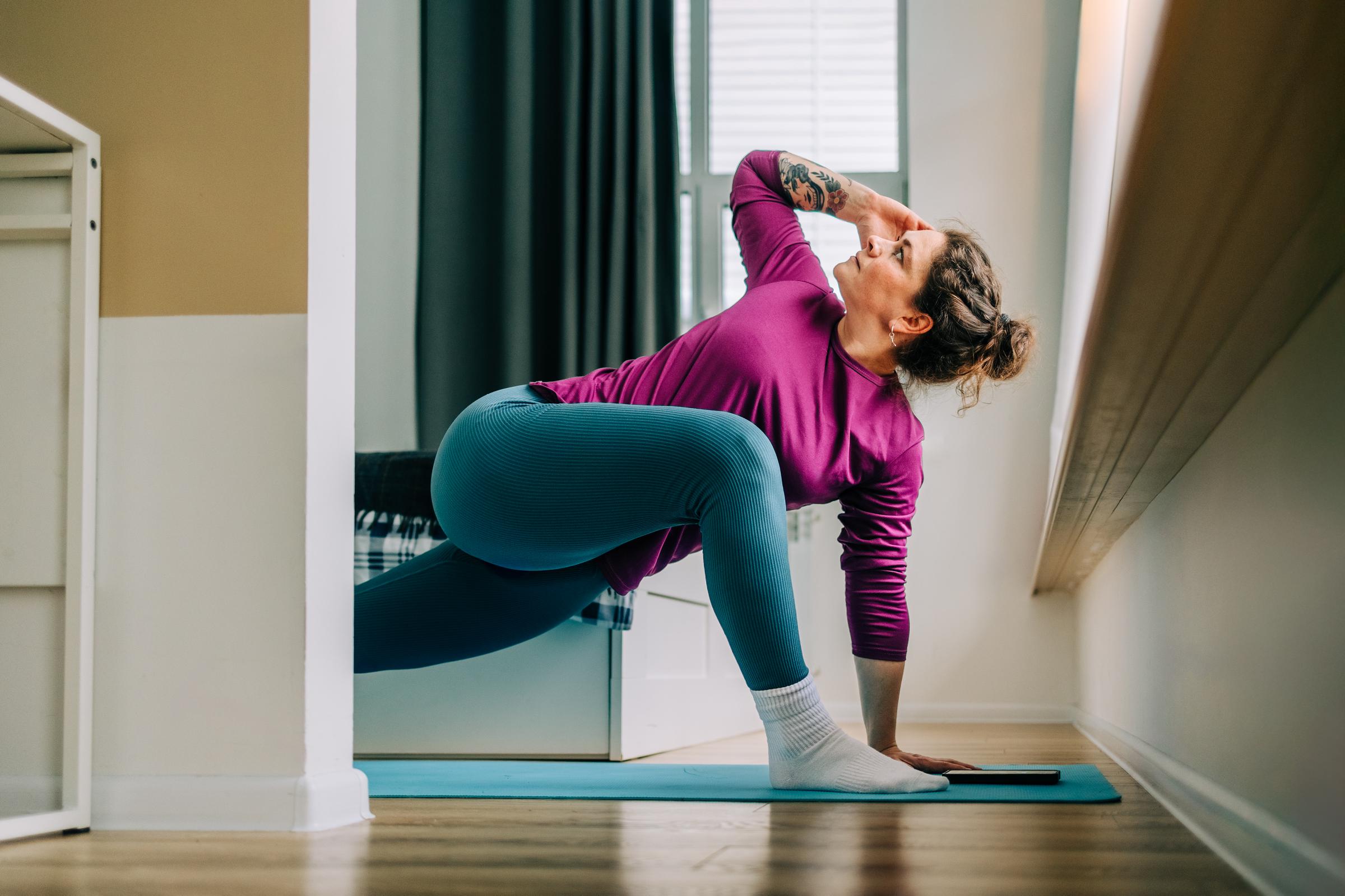 A woman doing at-home yoga | Source: Getty Images