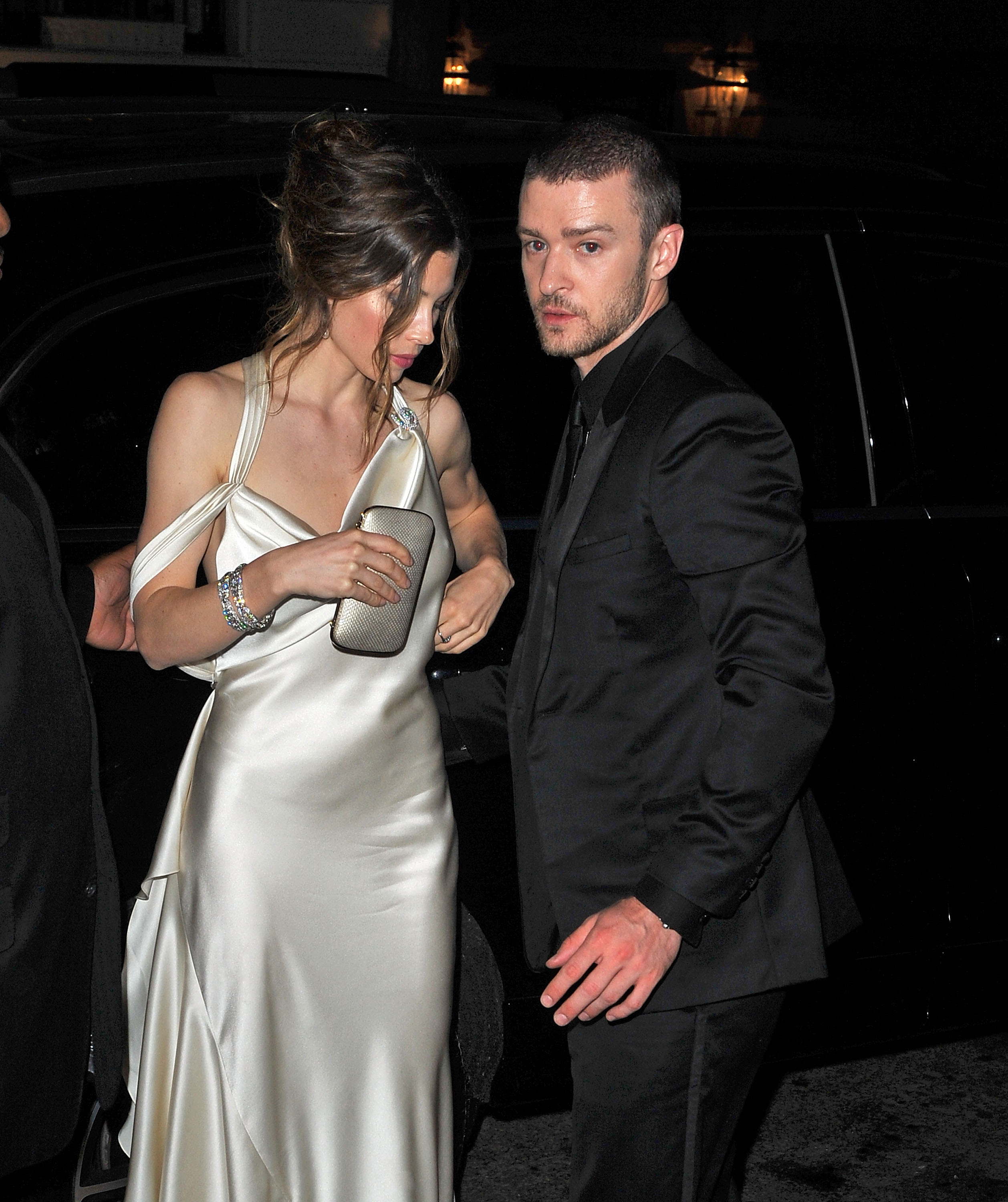 Jessica Biel and Justin Timberlake attend the Costume Institute Gala after-party, with Biel wearing a white satin gown with a draped neckline and Timberlake in a black suit. | Source: Getty Images