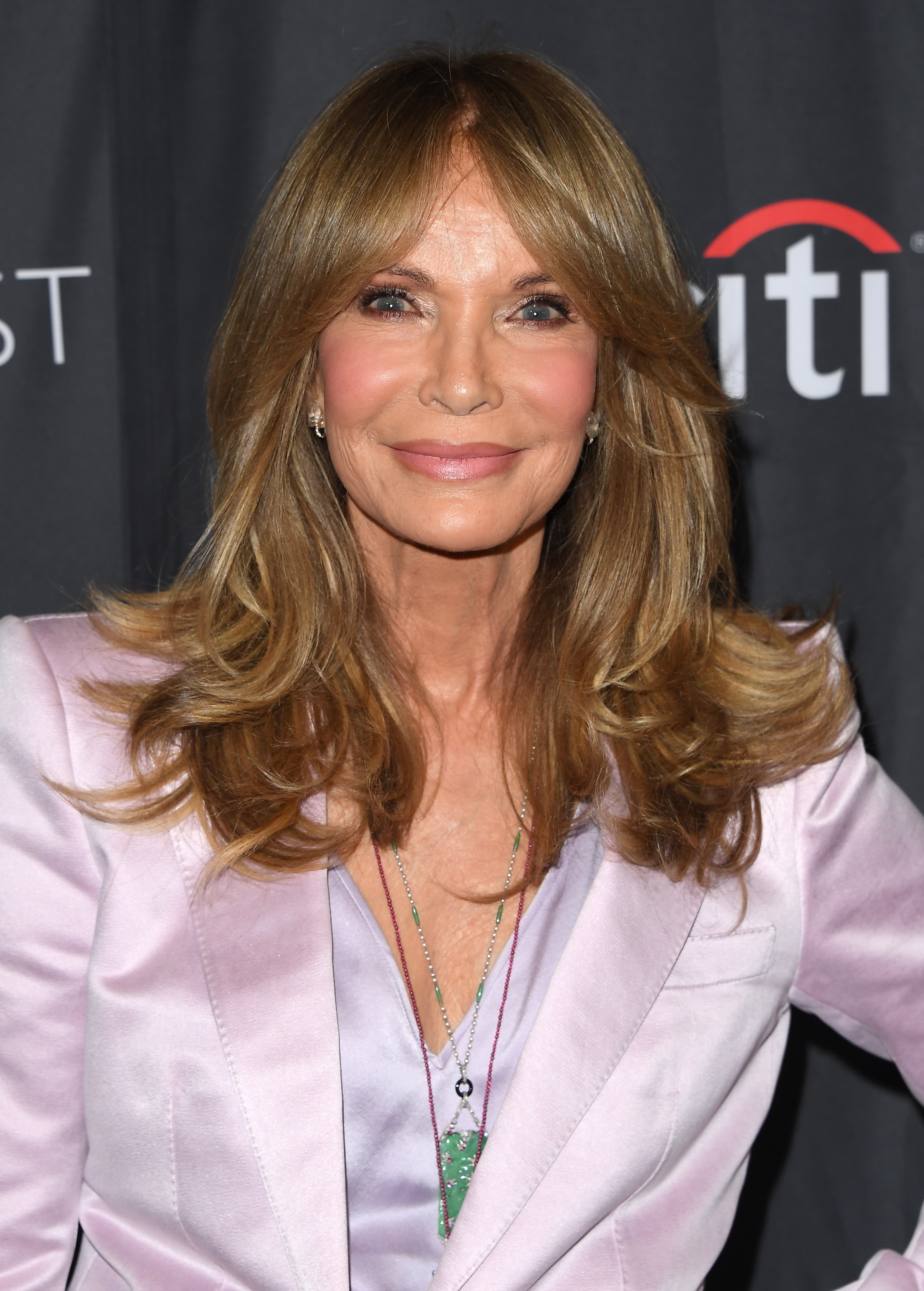 Jaclyn Smith attends PaleyFest LA on April 6, 2026, smiling for photographers, her polished makeup and soft waves drawing attention on the red carpet.