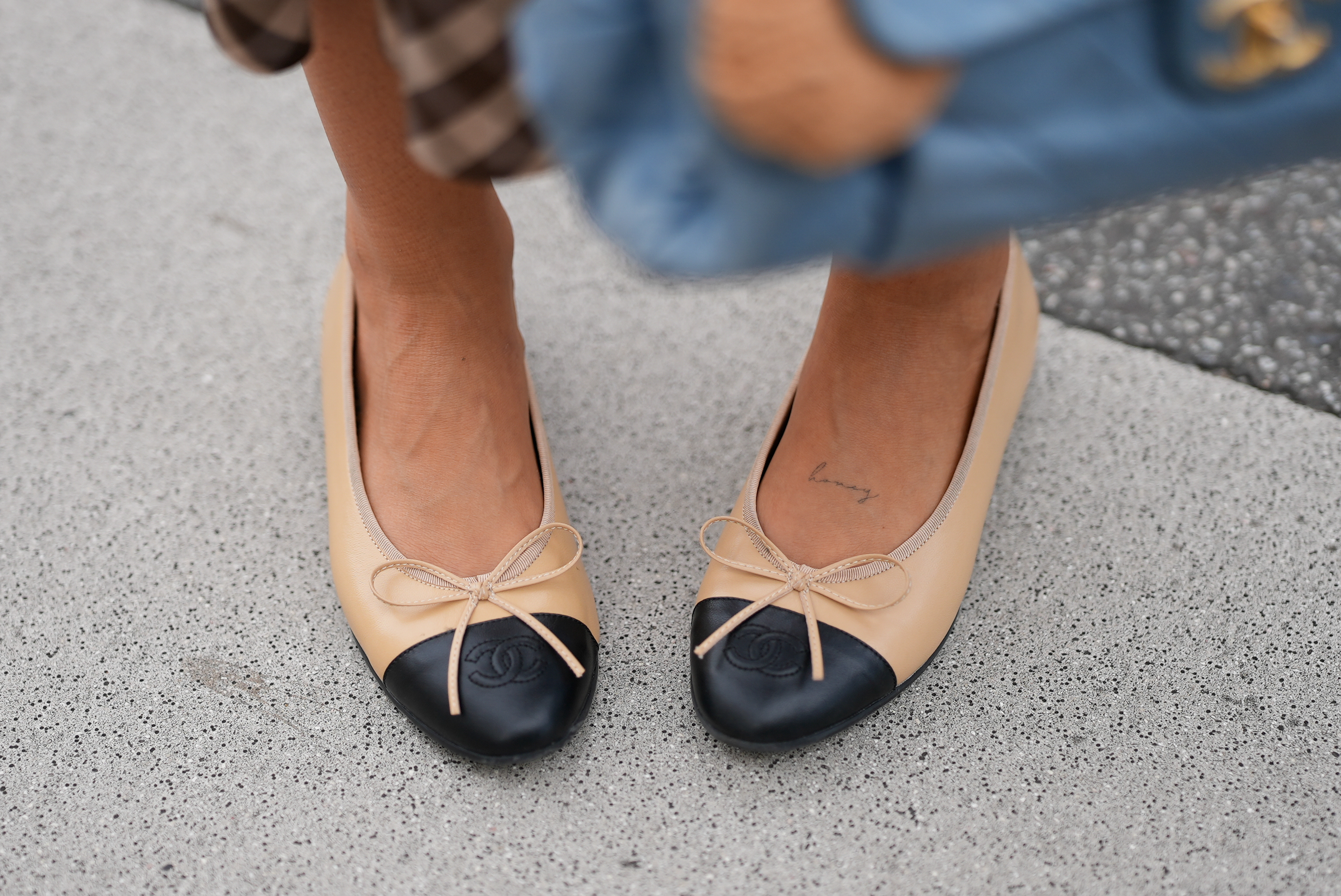A pair of Chanel two-tone cap toe leather flats worn by Julia Kammerer on August 7, 2026 | Source: Getty Images