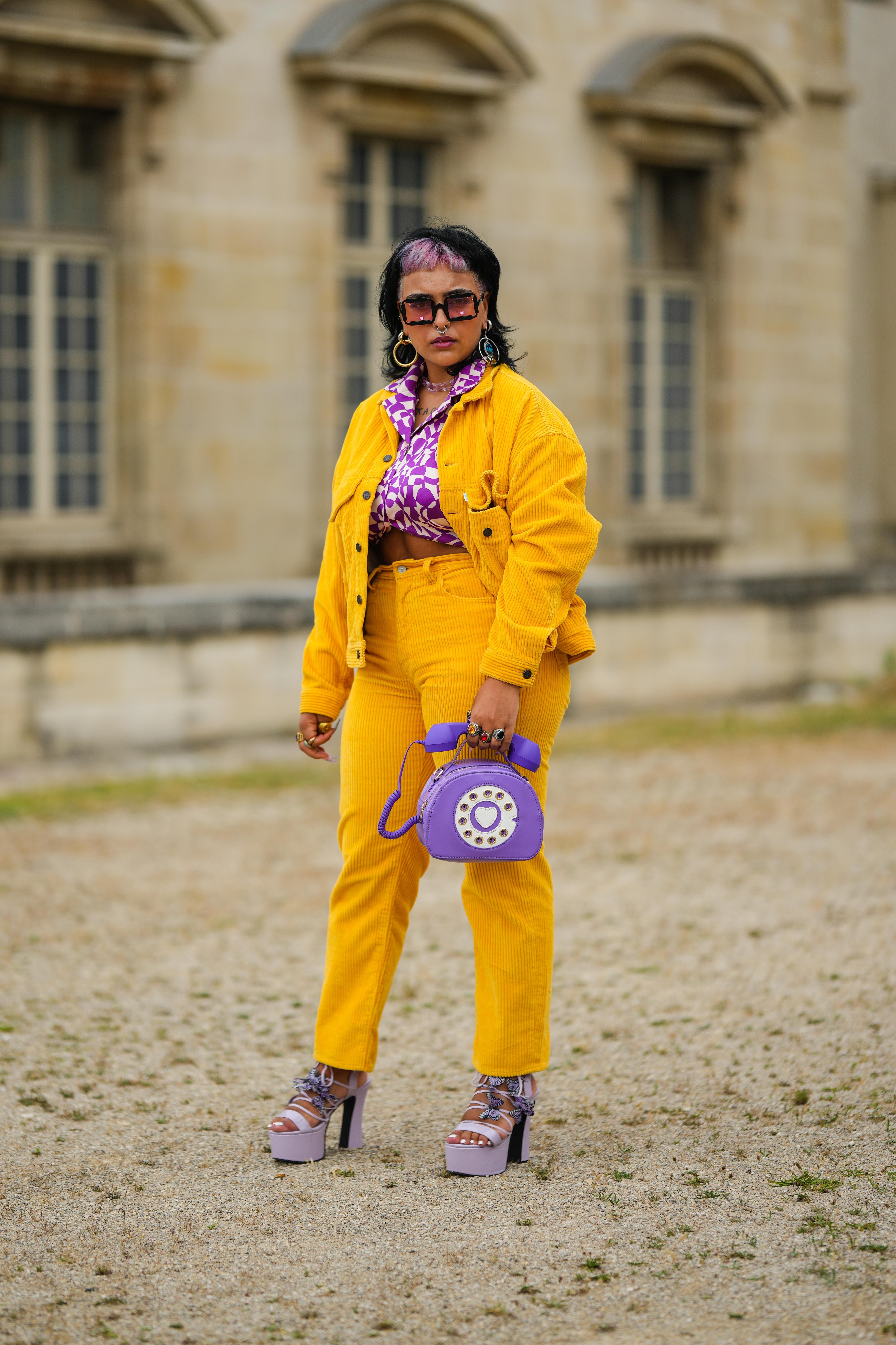A woman photographed wearing matching corduroy pants and jacket during Paris Fashion Week - Menswear Spring/Summer 2023, on June 22, 2022, in Paris, France. | Source: Getty Images
