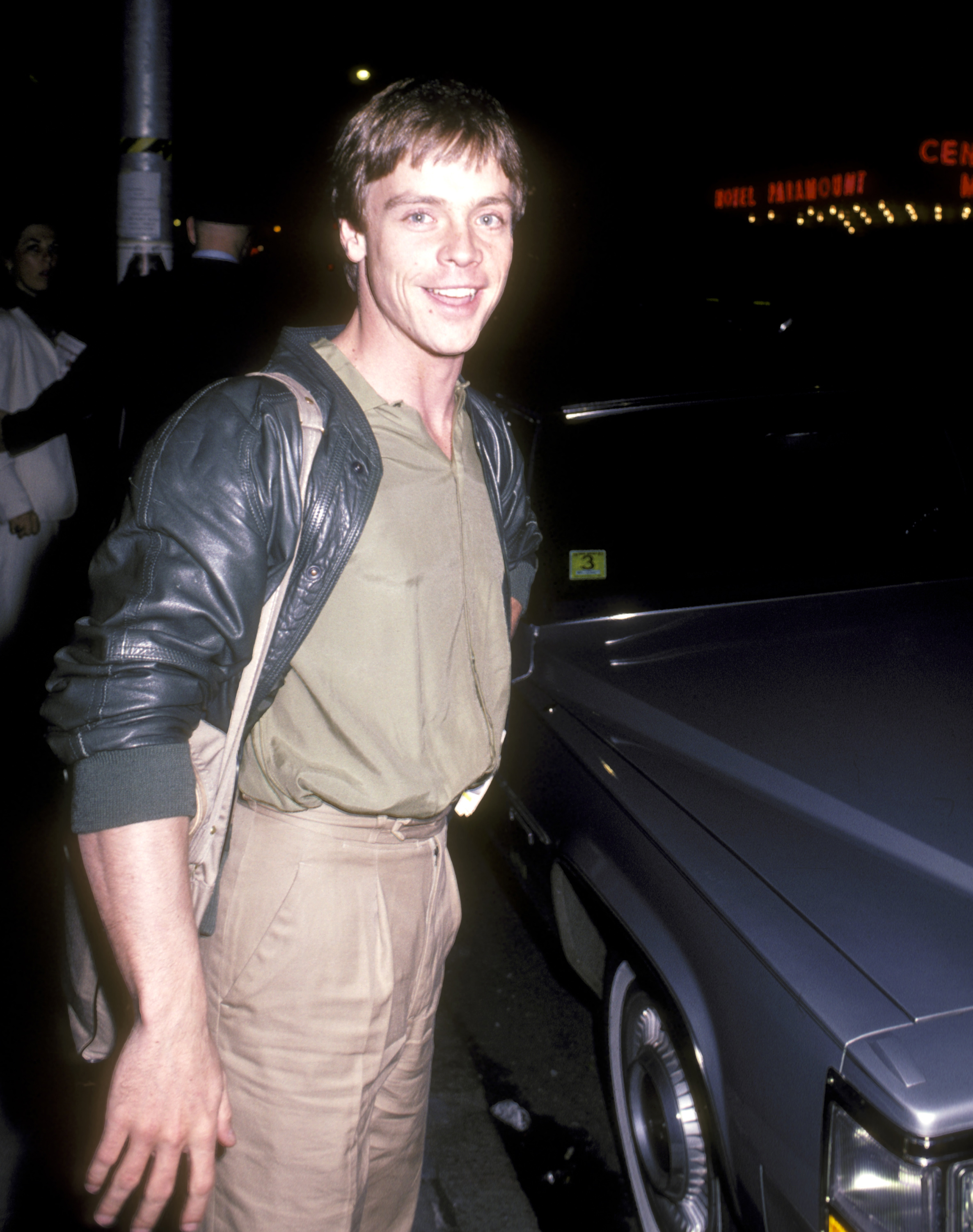 Mark Hamill posed beside a car in a throwback photo, capturing him during his younger years as his career and family life continued to take shape. | Source: Getty Images