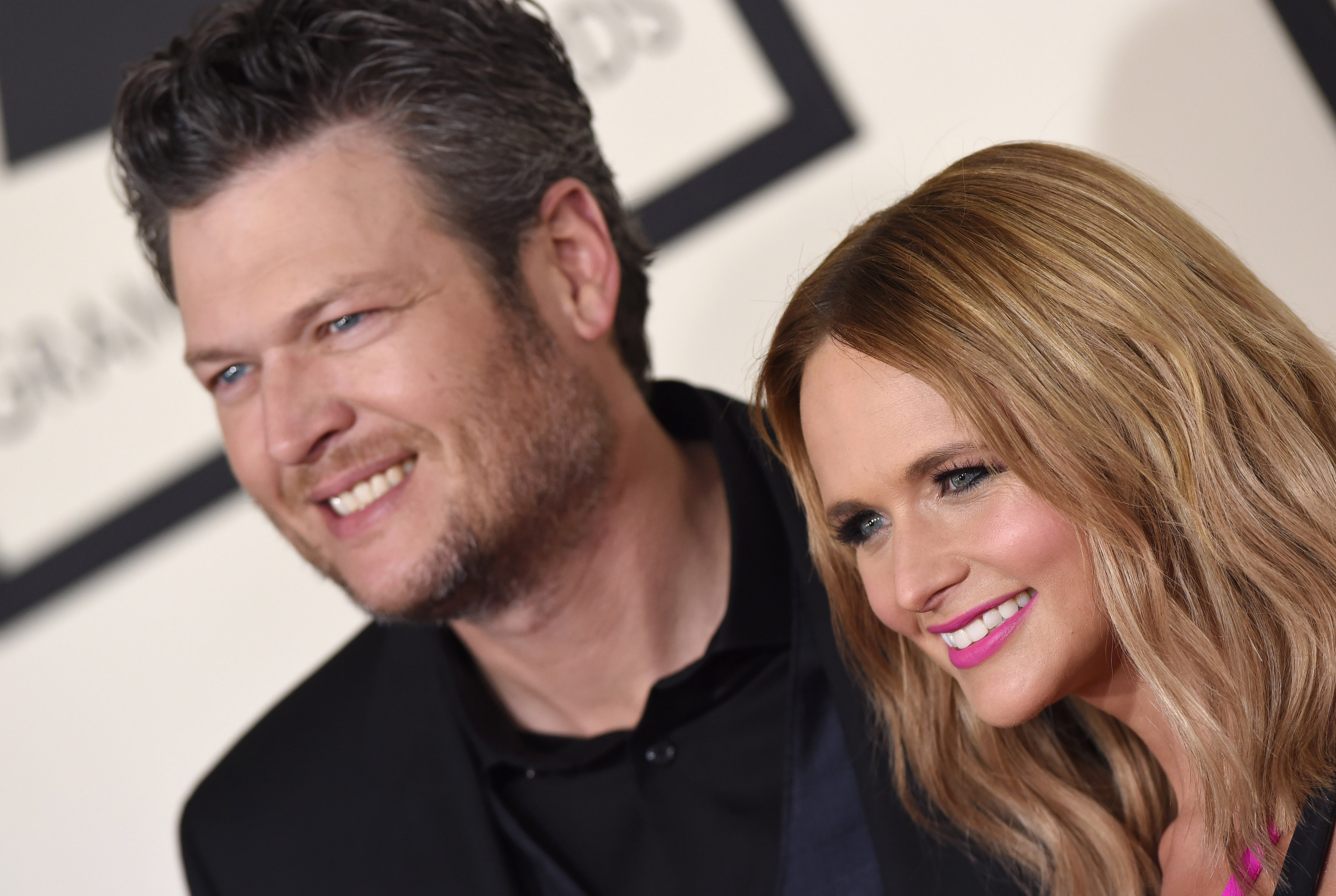 Blake Shelton and Miranda Lambert smile together on the red carpet at the 57th Annual Grammy Awards in Los Angeles on February 8, 2015. Stepping out as one of music's most celebrated power couples, the high-profile awards appearance turned out to be one of their final major public outings together. Just five months later, in July 2015, the pair shocked country music fans by announcing their decision to divorce after four years of marriage and a decade together. | Source: Getty Images