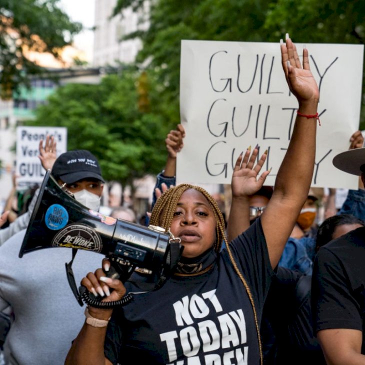 ATLANTA, GA - APRIL 20: Porchse Queen Miller (center) and others march through the streets after the verdict was announced for Derek Chauvin on April 20, 2021 in Atlanta, United States. Former police officer Derek Chauvin was on trial on second-degree murder, third-degree murder and second-degree manslaughter charges in the death of George Floyd May 25, 2020. After video was released of then-officer Chauvin kneeling on Floyd's neck for nine minutes and twenty-nine seconds, protests broke out across the U.S. and around the world. The jury found Chauvin guilty on all three charges. (Photo by Megan Varner/Getty Images)