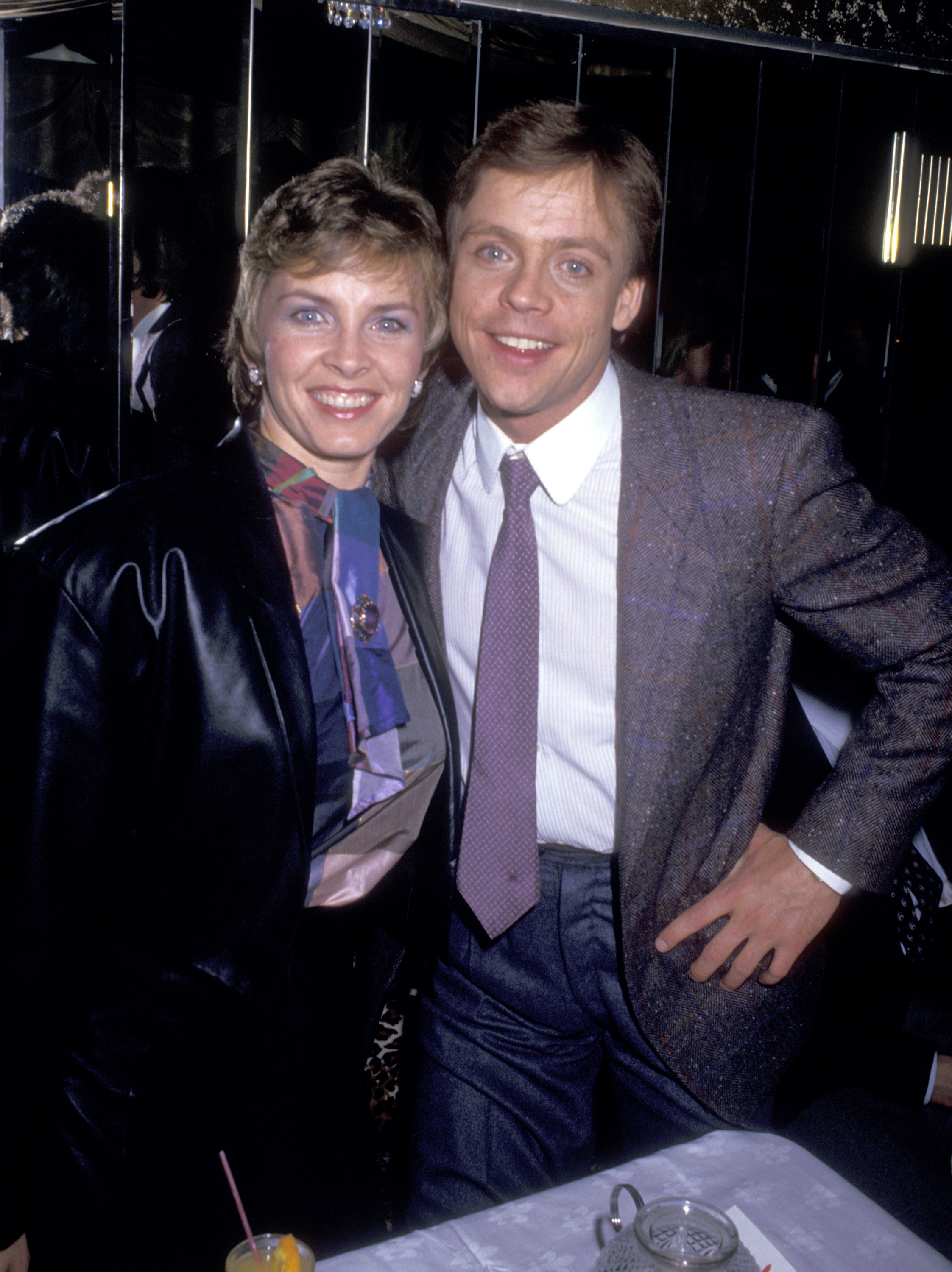 Mark Hamill and Marilou York smiled together at an event in a throwback photo, reflecting the decades-long partnership they have built since marrying in 1978. | Source: Getty Images