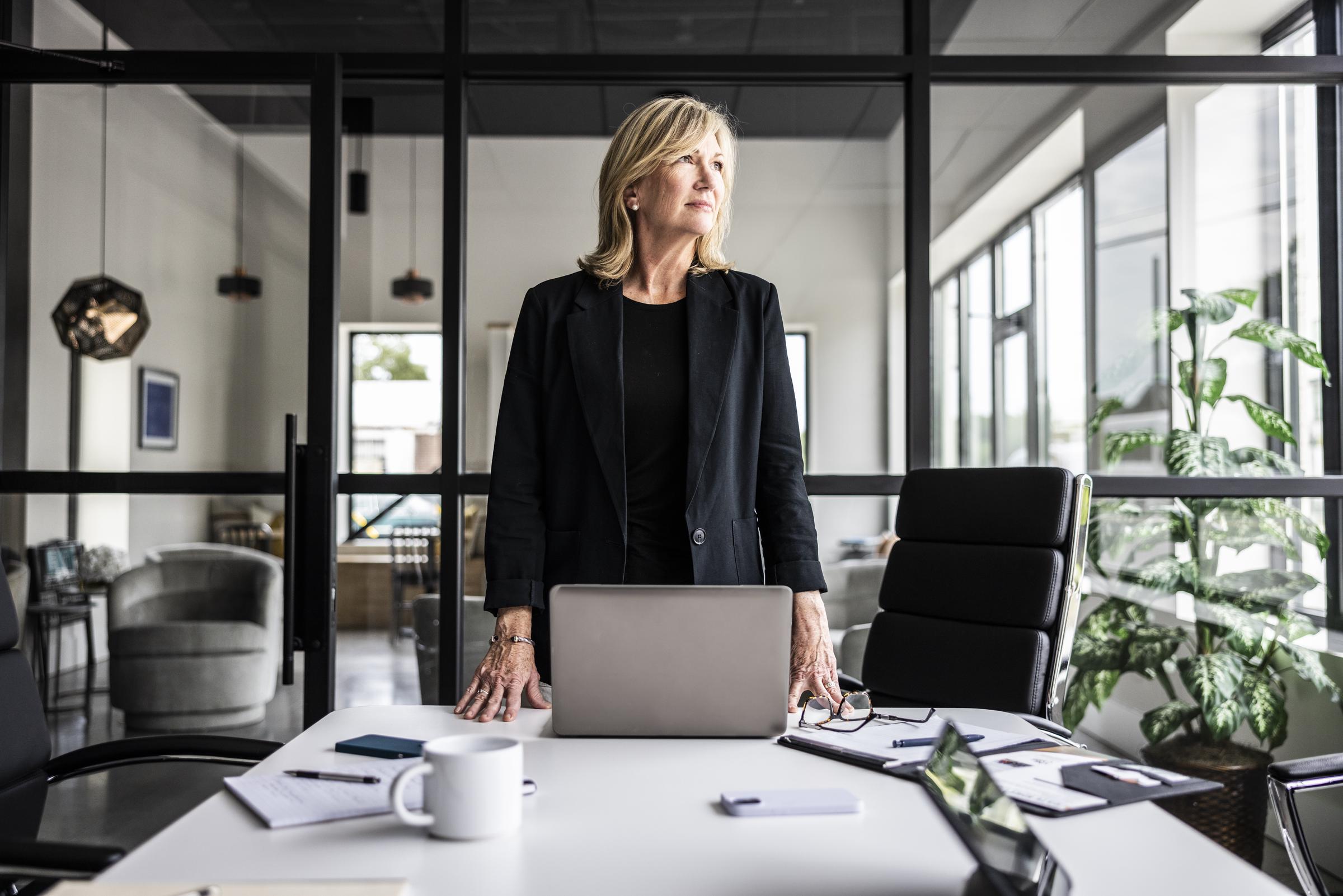 A woman looks on in a conference room | Source: Getty Images