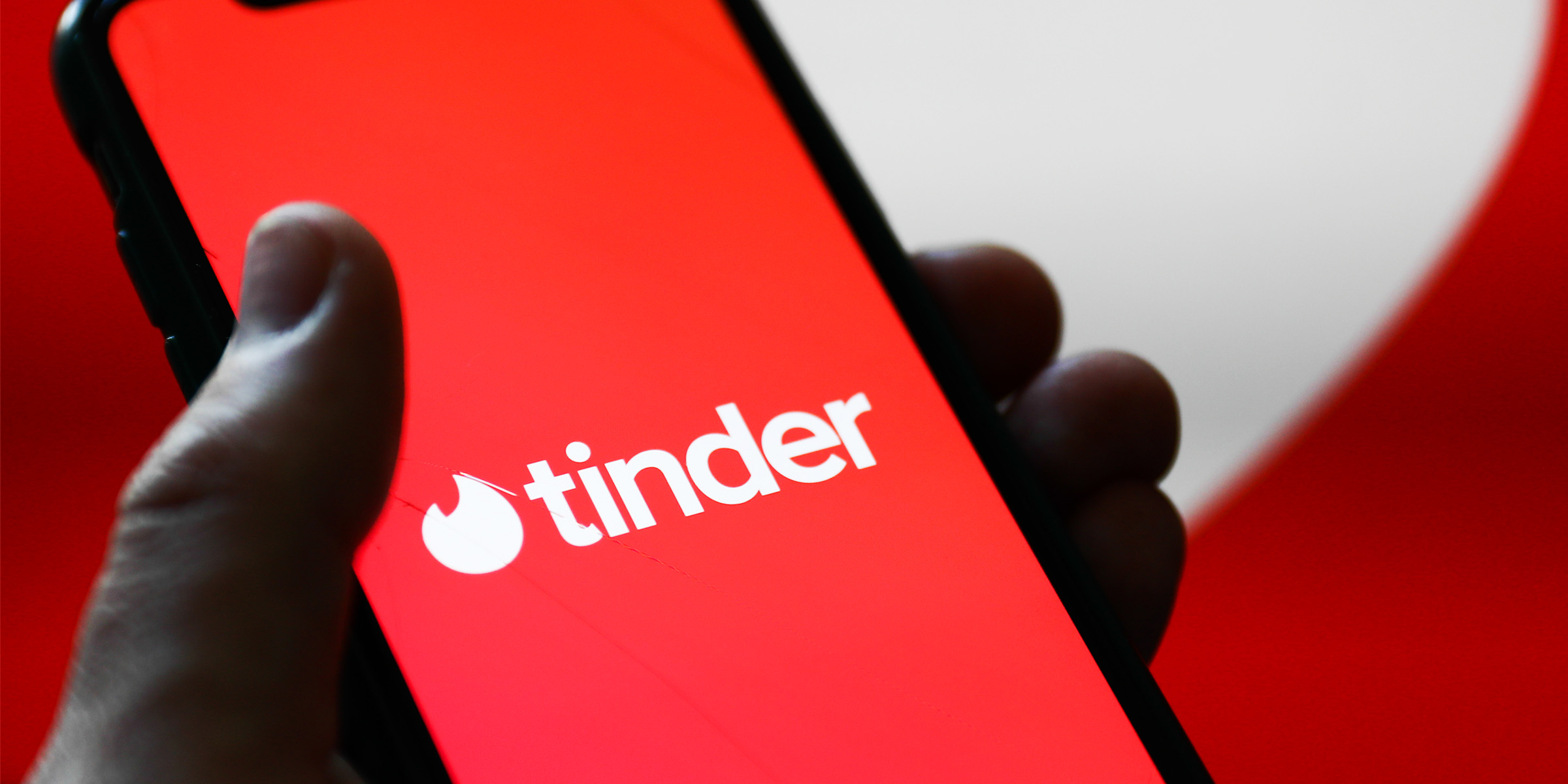 A person using Tinder app on their phone | Source: Shutterstock