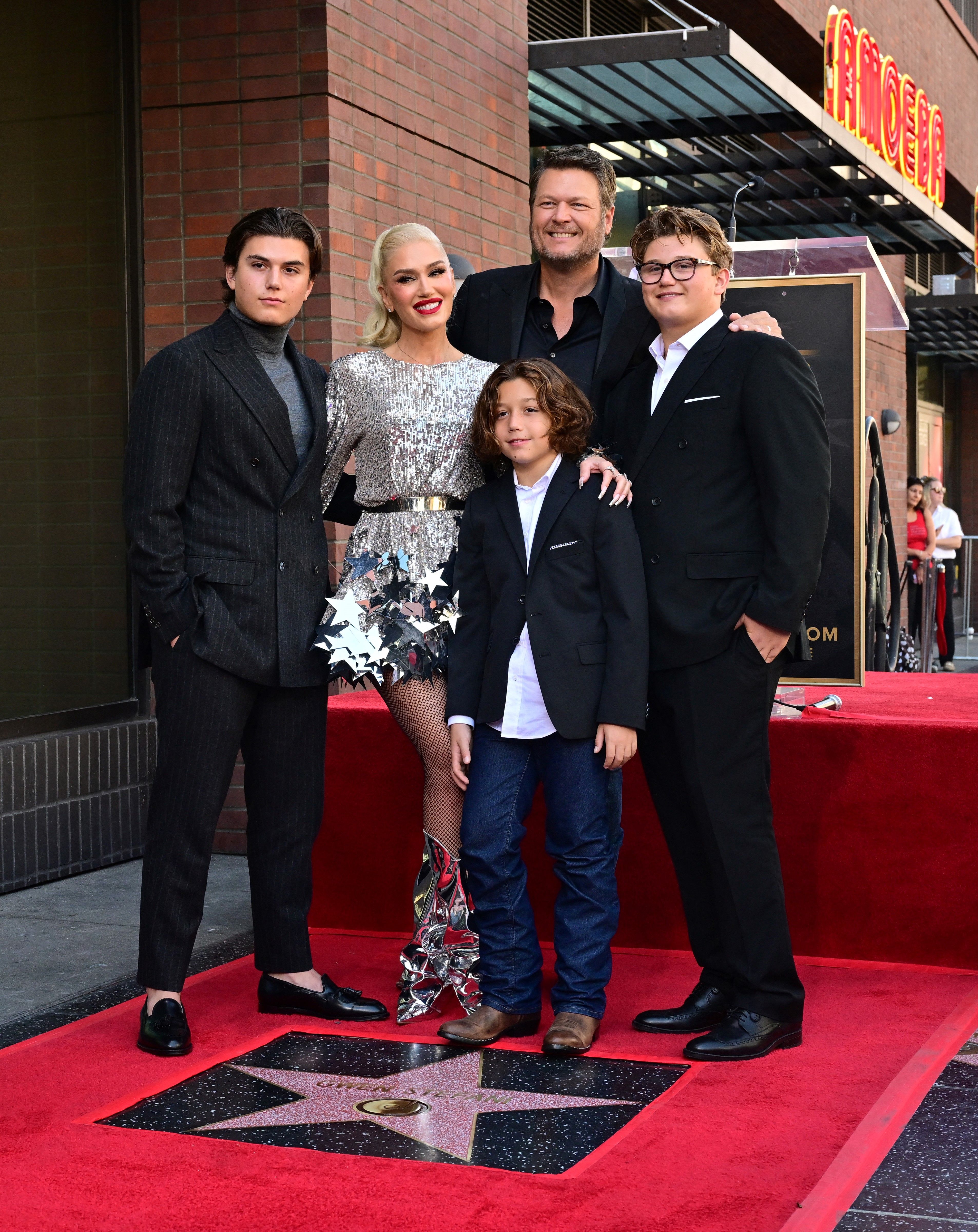 Gwen Stefani and Blake Shelton with Kingston, Zuma, and Apollo Rossdale during her Hollywood Walk of Fame star ceremony in California on October 19, 2023. | Source: Getty Images