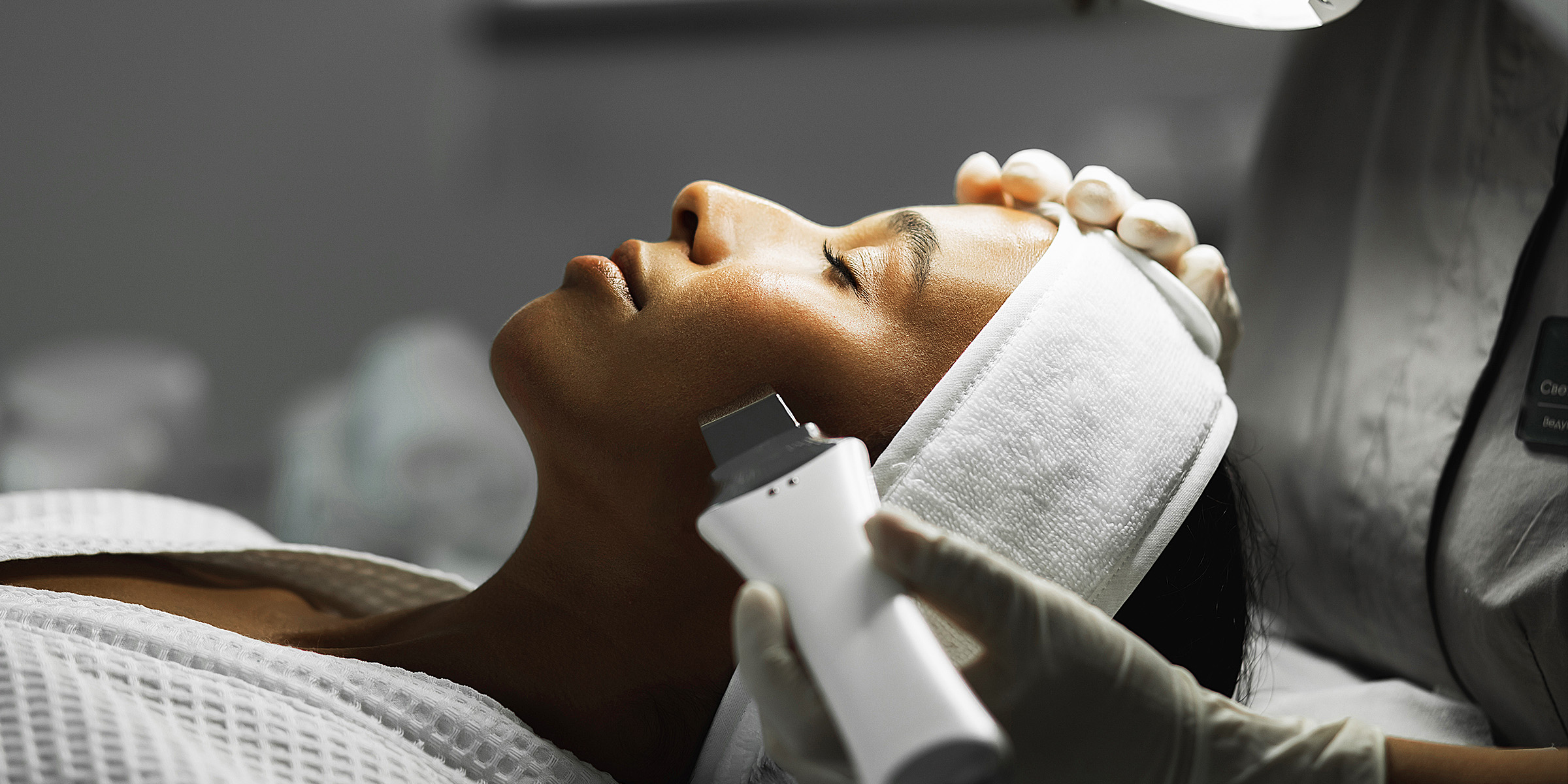 A woman undergoing microdermabrasion treatment | Source: Getty Images