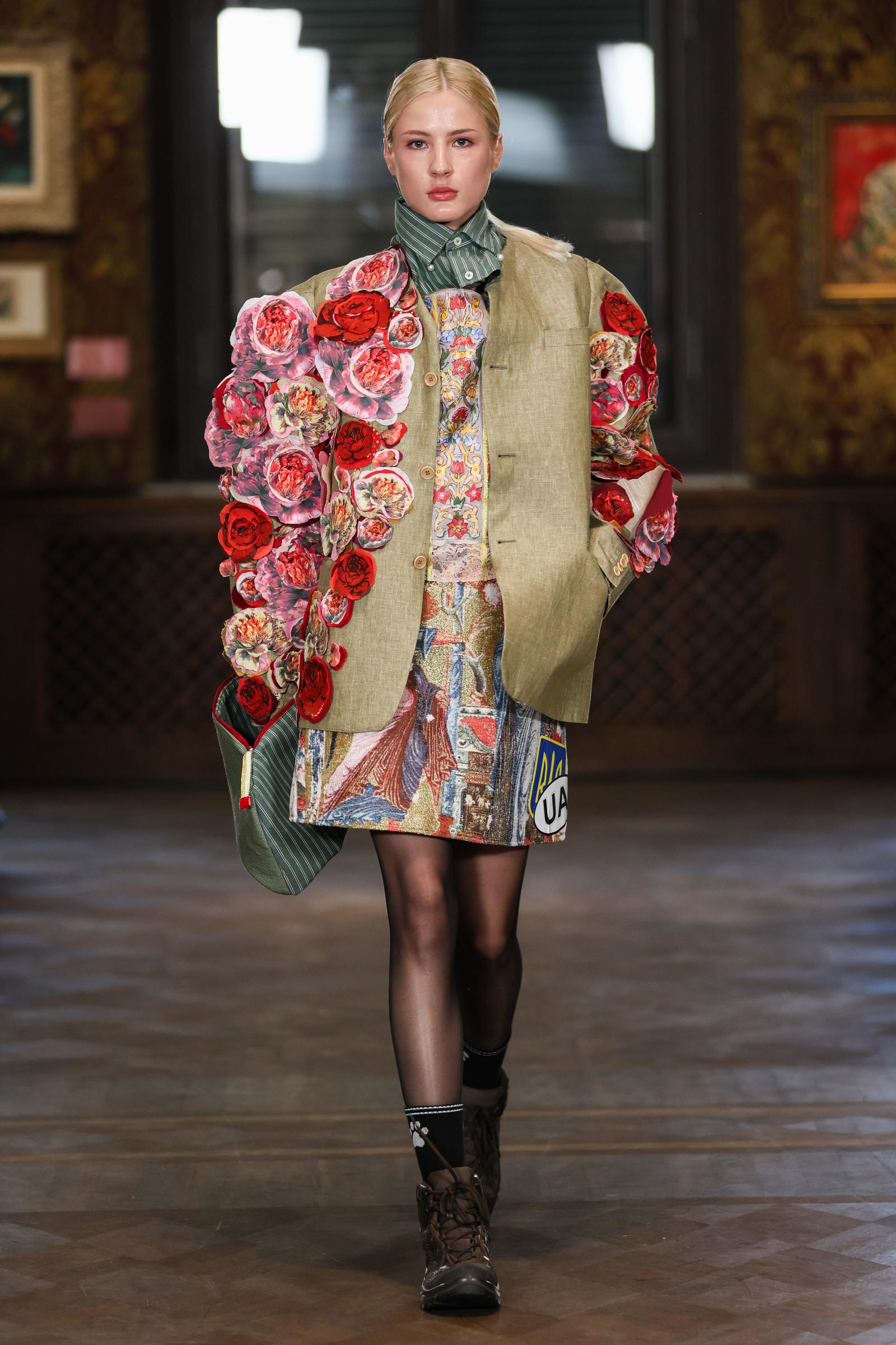 A model wearing an ensemble of mixed paterns with a solid break, designed by Nadiia Dobrovolskay during the finalists’ show of the XXVI All-Ukrainian Contest of Young Fashion Designers “A Look into the Future on September 4, 2025 in Kyiv | Source: Getty Images