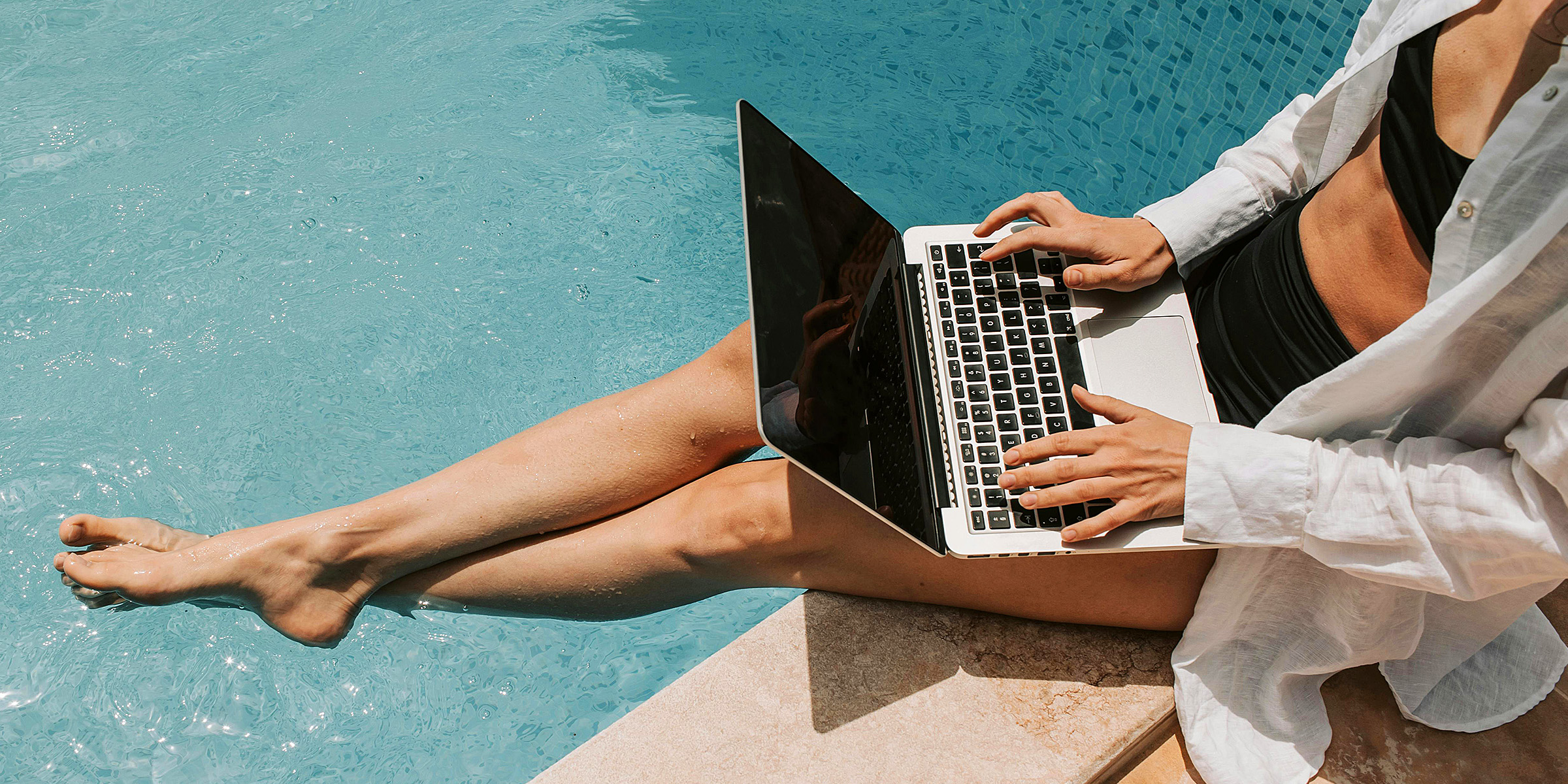 A woman working by the pool | Source: Pexels