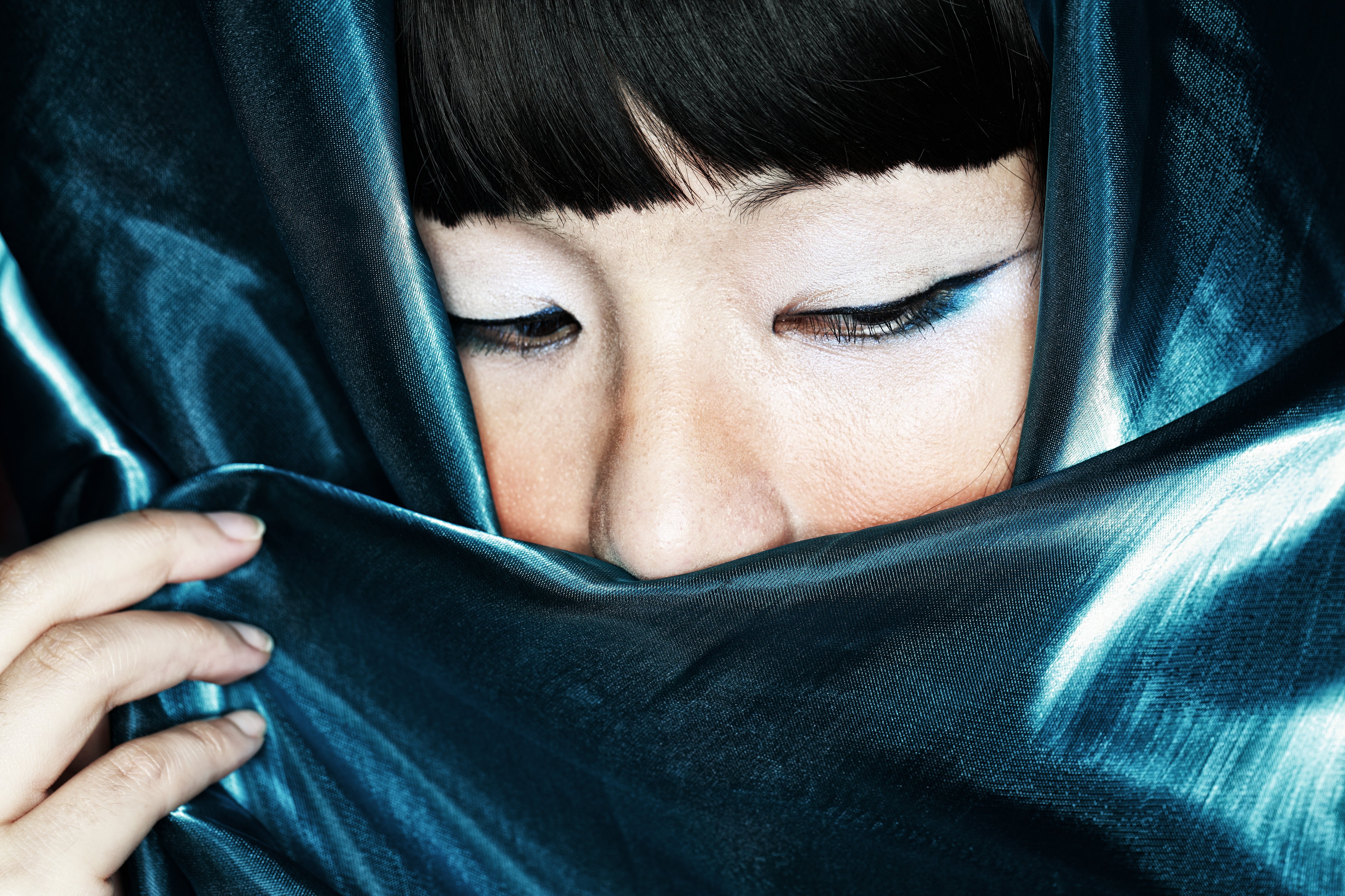 Woman with a silk scarf. | Source: Getty Images