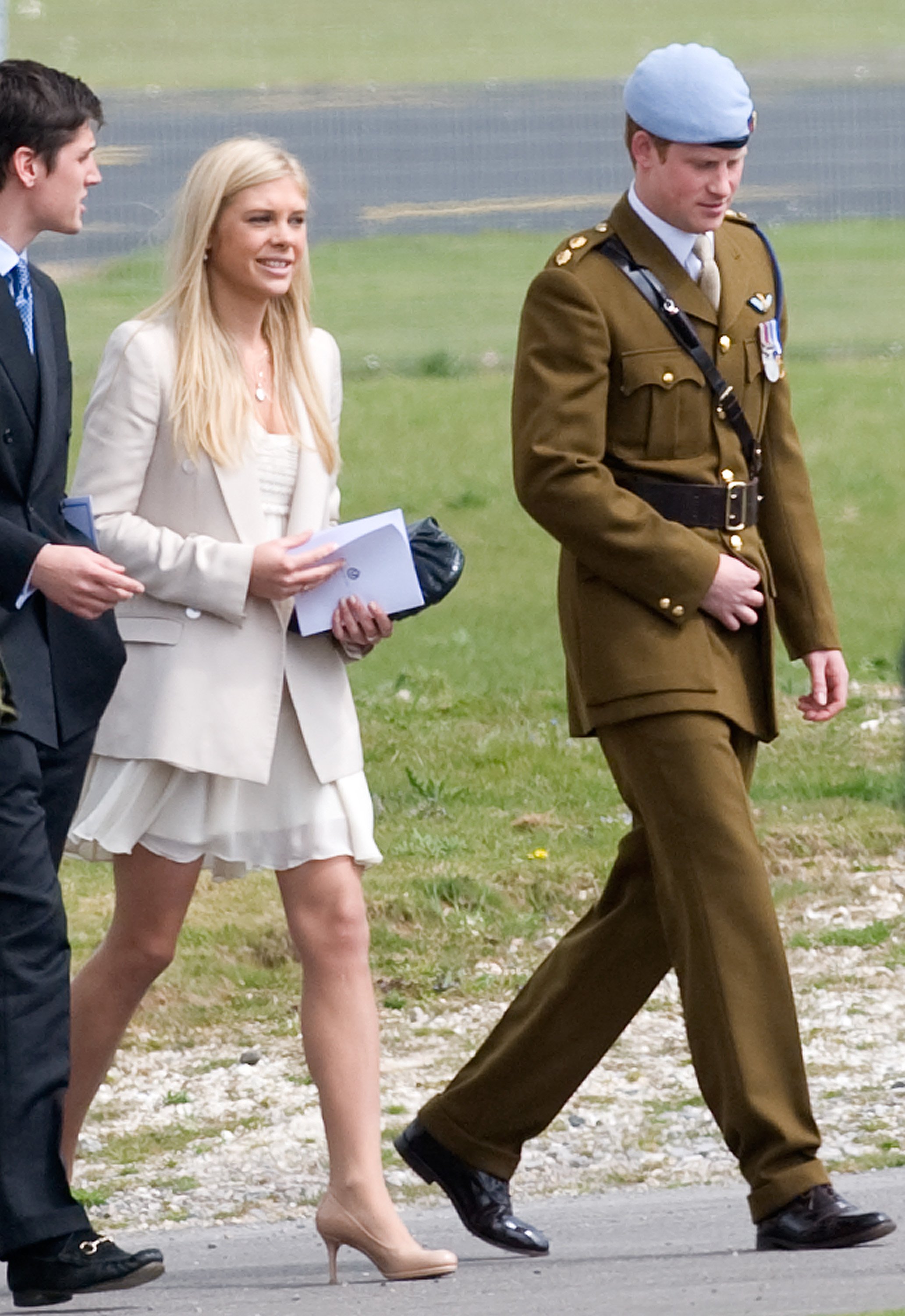 Chelsy Davy and Prince Harry walking after he received his flying badges at the Museum of Army Flying. | Source: Getty Images