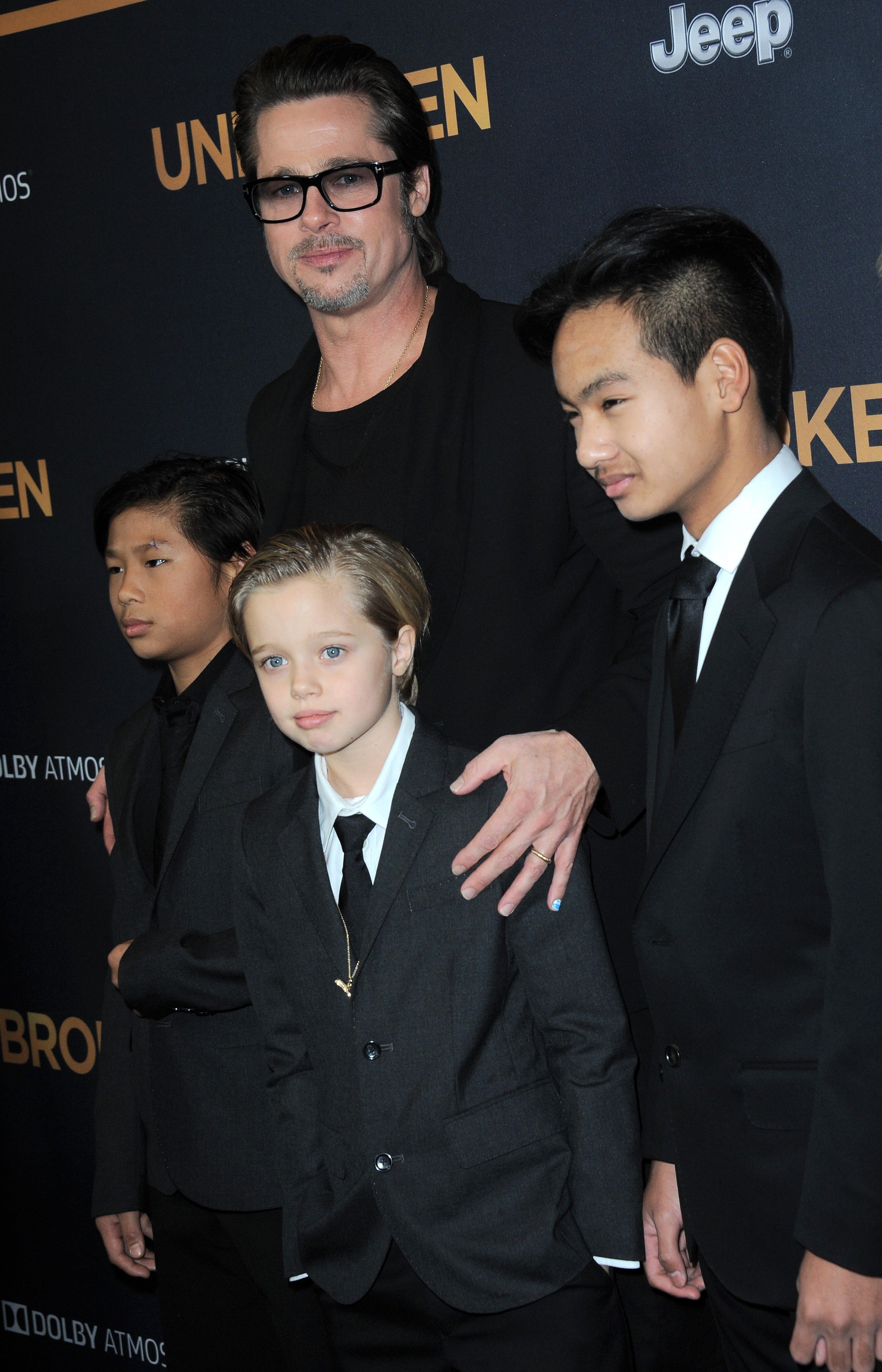 Brad Pitt, Pax, Shiloh, and Maddox Jolie-Pitt at the premiere of "Unbroken" on December 15, 2014, in Hollywood, California | Source: Getty Images