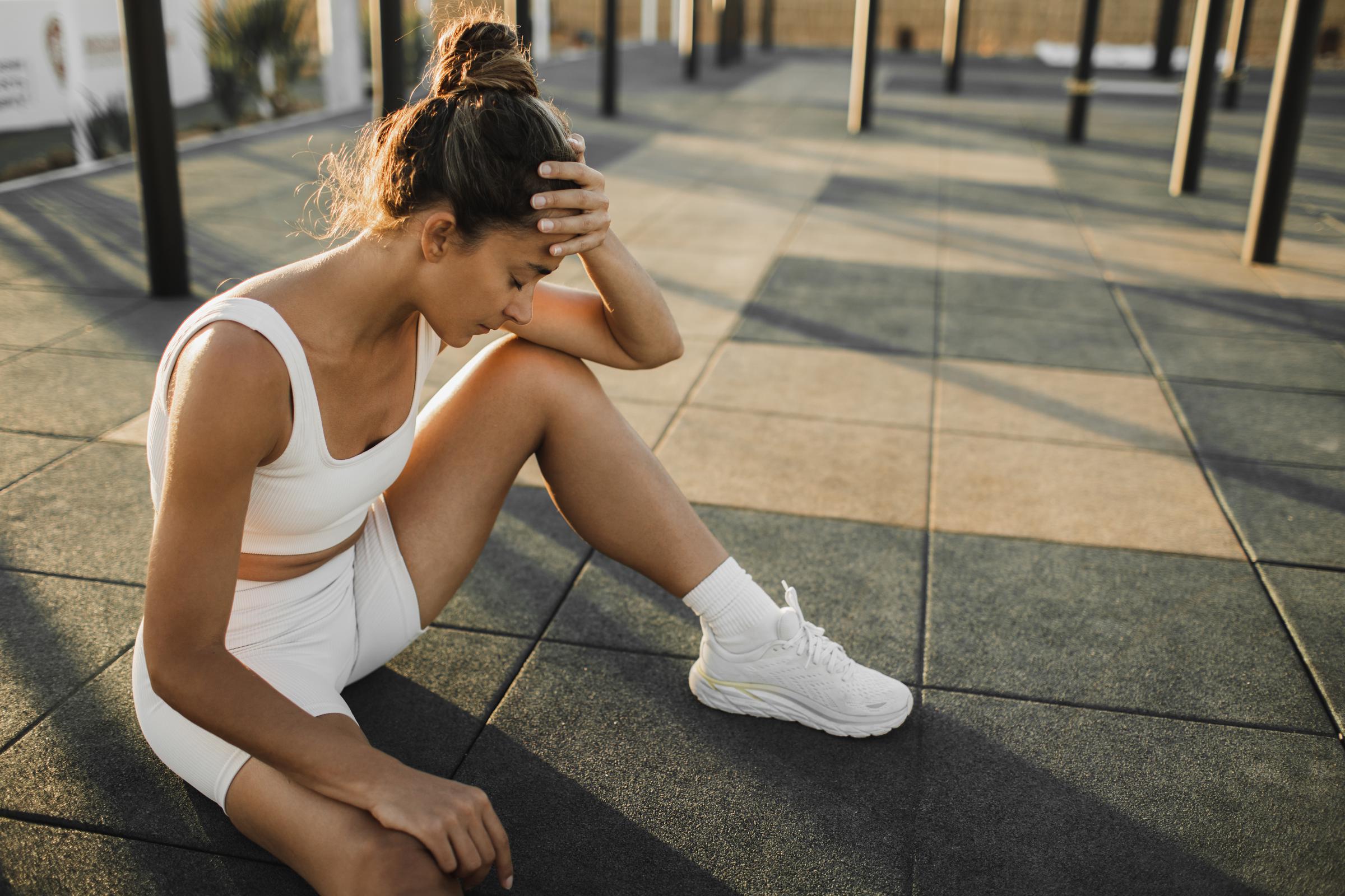 A woman taking a break during her workout | Source: Getty Images