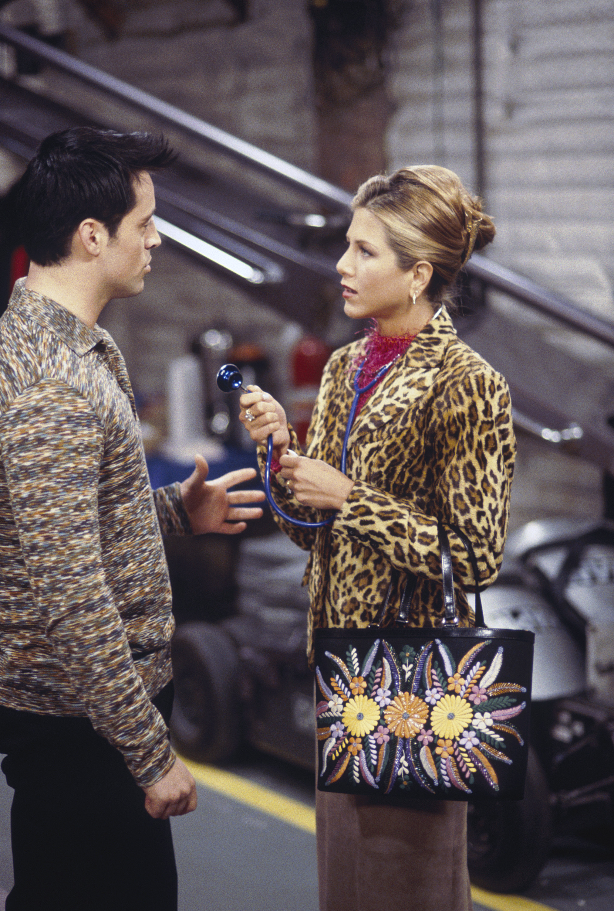 Jennifer Aniston as Rachel Green, wearing a leopard-print blazer while speaking to Joey, played by Matt LeBlanc, from a "Friends" episode in 2000 | Source: Getty Images