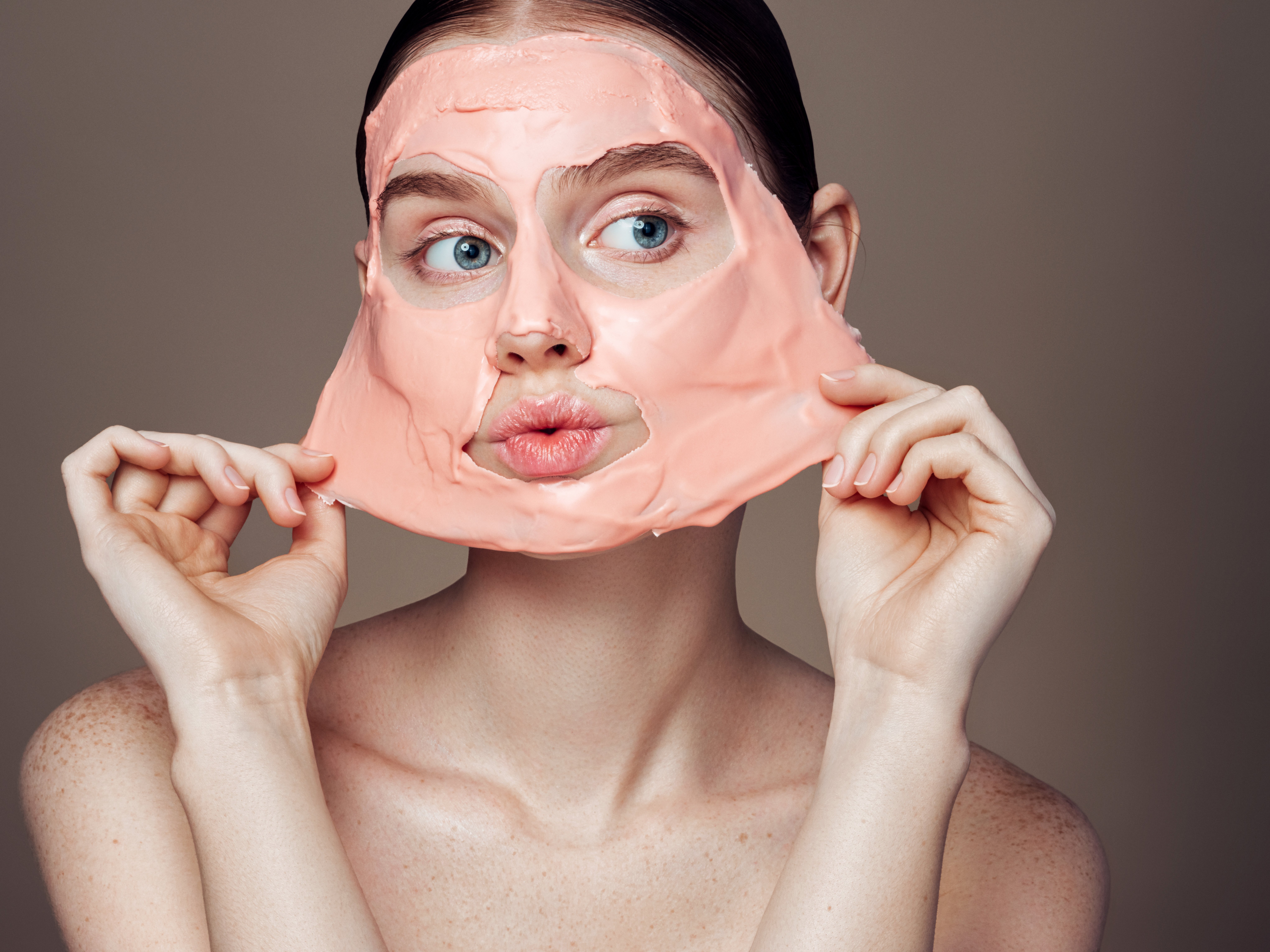 Woman removing facial mask | Source: Getty Images