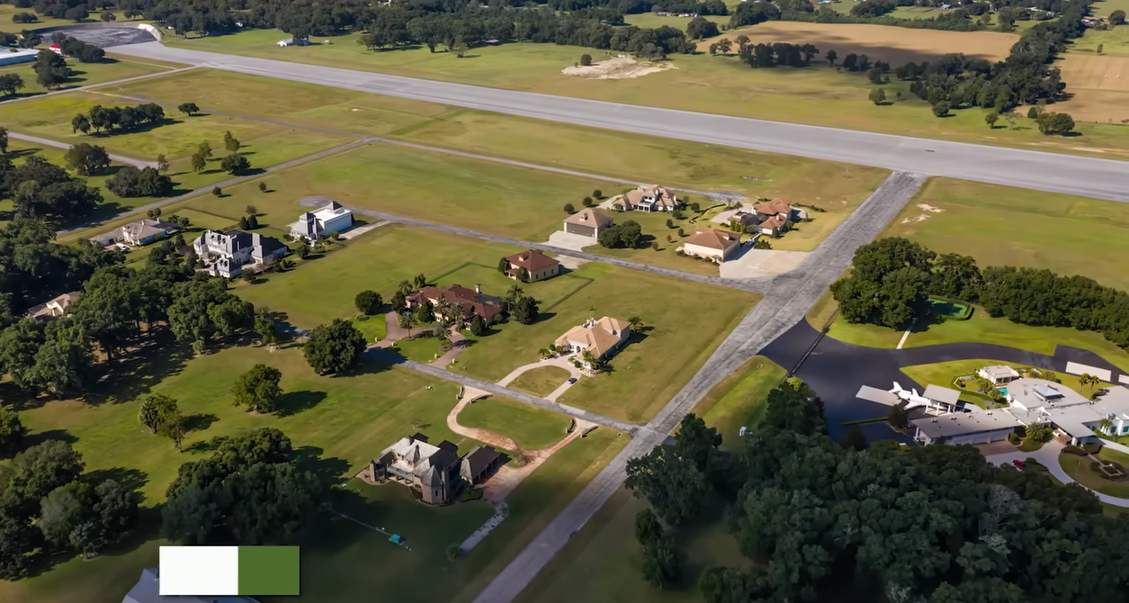 From above, Jumbolair Aviation Estates looks more like an airfield than a conventional neighborhood, with homes connected to a massive runway. | Source: YouTube/@Therichest