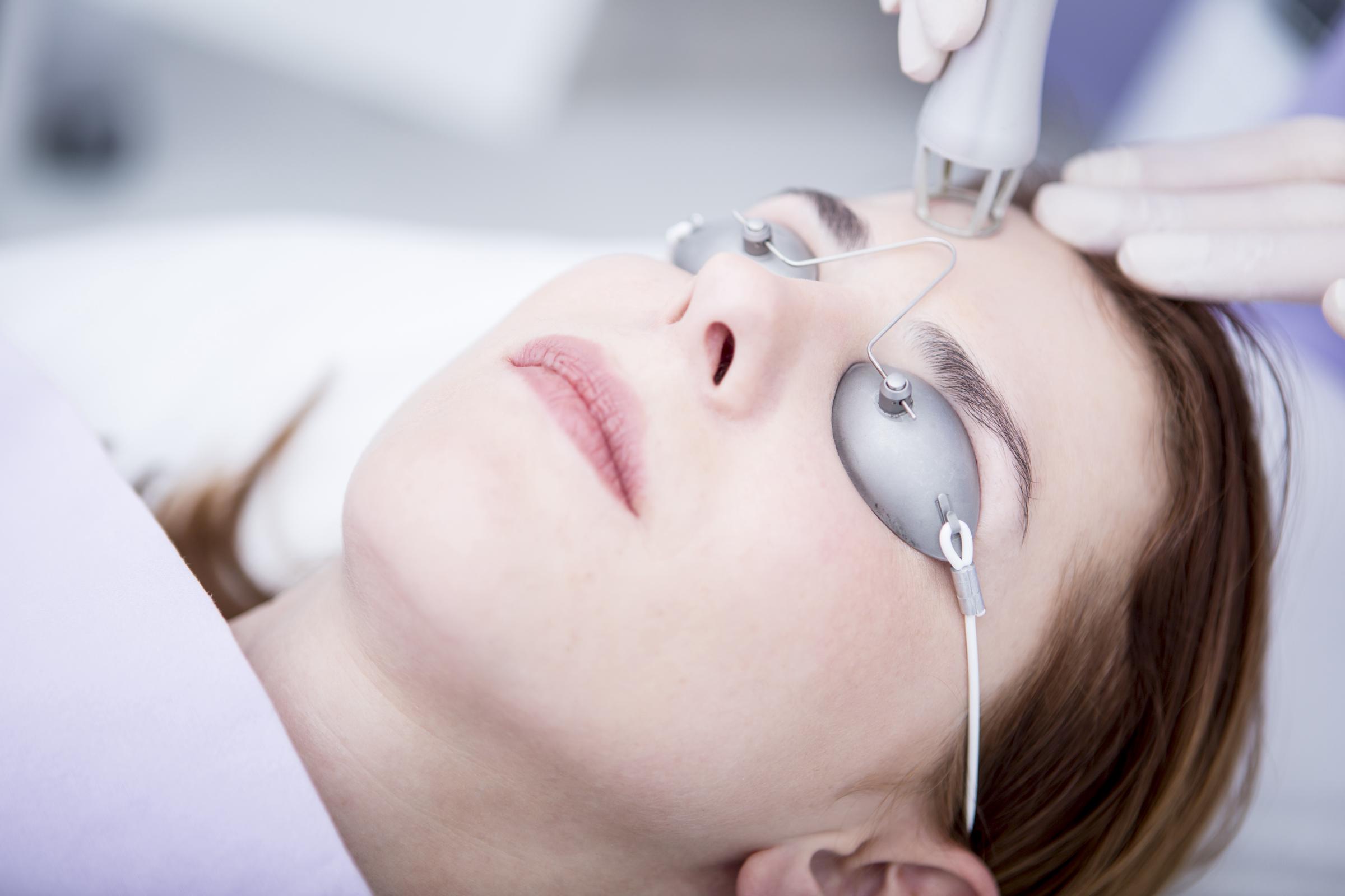 A woman undegoing laser treatment | Source: Getty Images
