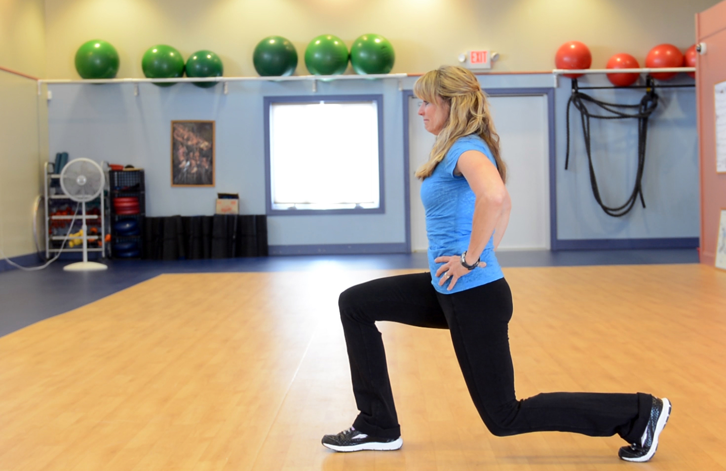 Lynn Kreider, owner of Ryan McFadden LJ's Fitness, demonstrating the forward lunge | Source: Getty Images