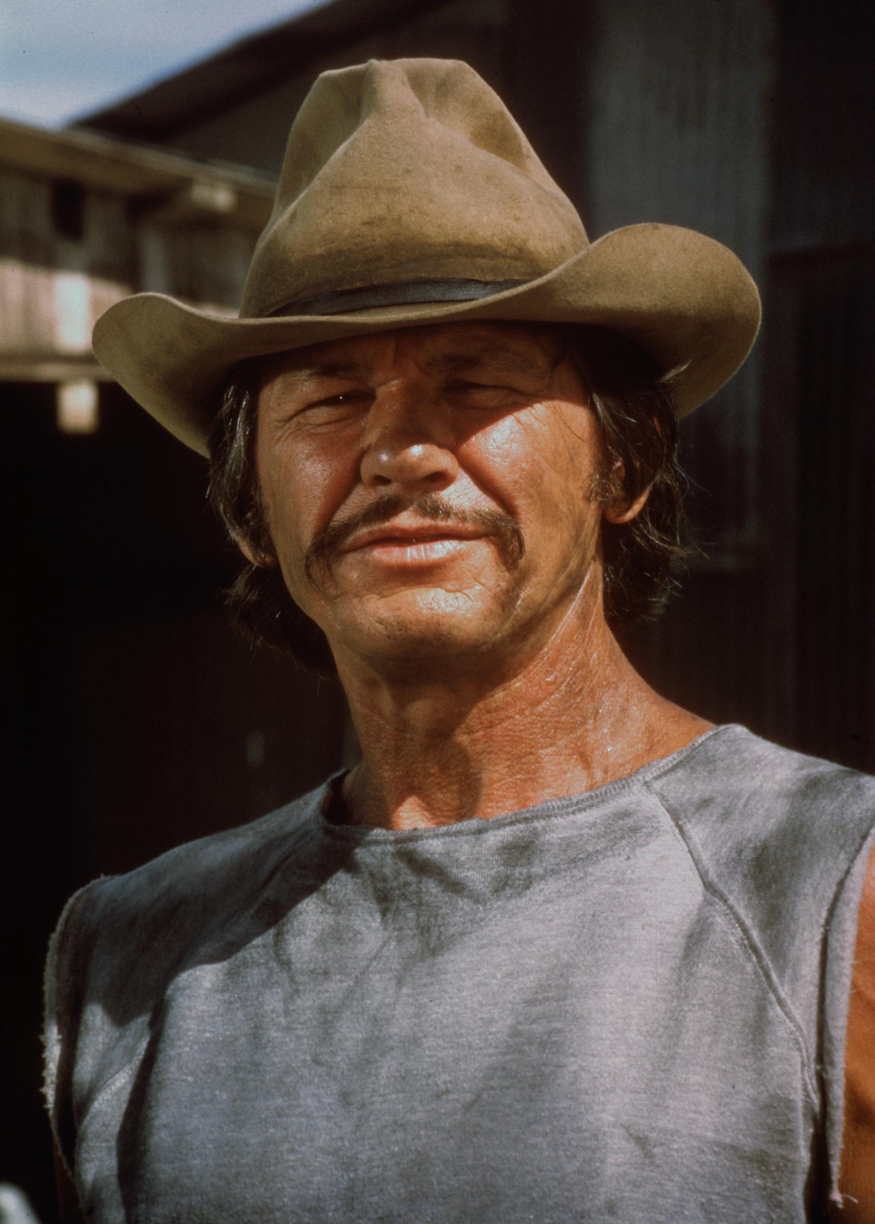 Charles Bronson appears in the 1975 action film "Breakout," one of the movies he made with his wife and frequent co-star Jill Ireland. | Source: Getty Images