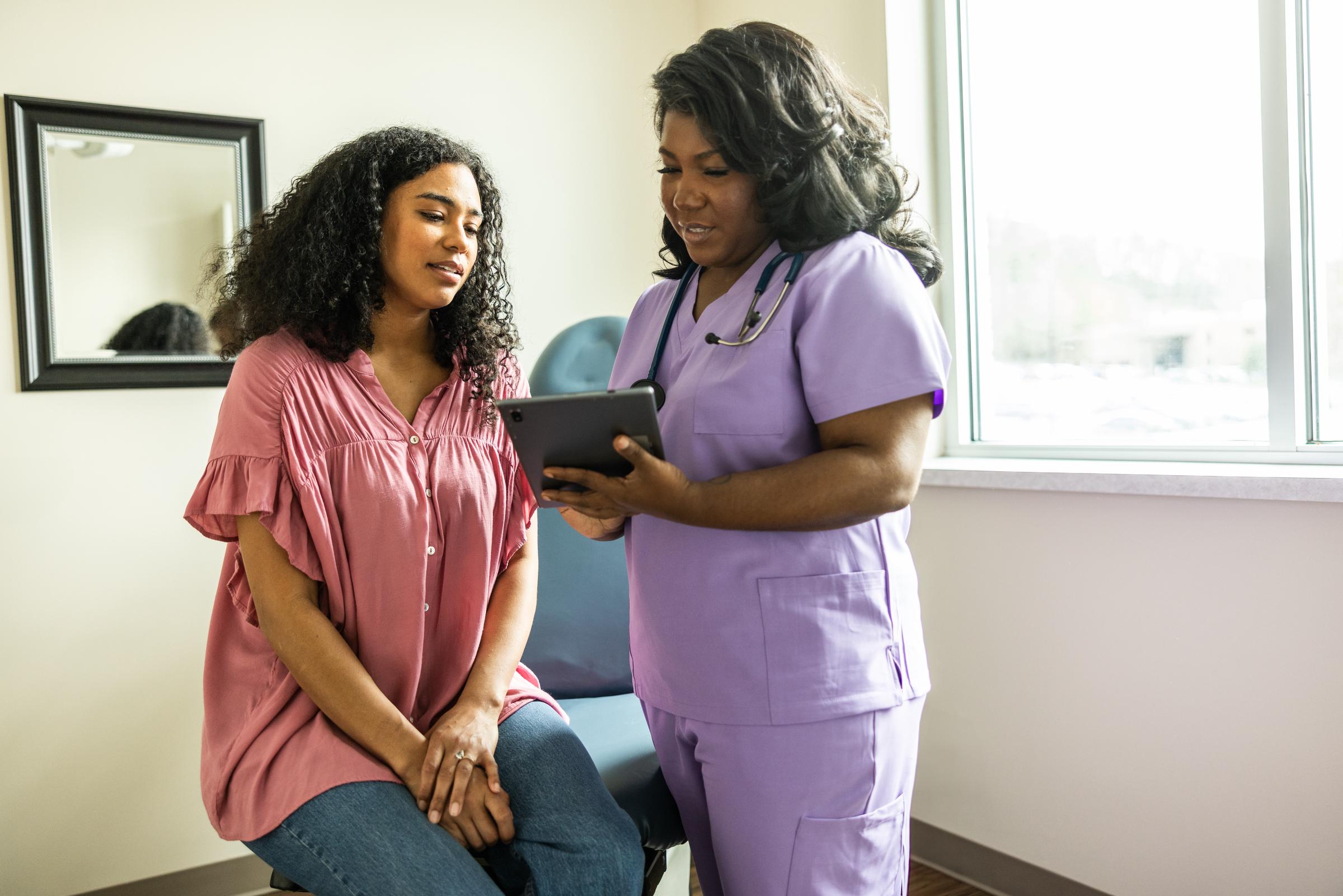 A young woman consulting with a doctor | Source: Getty Images