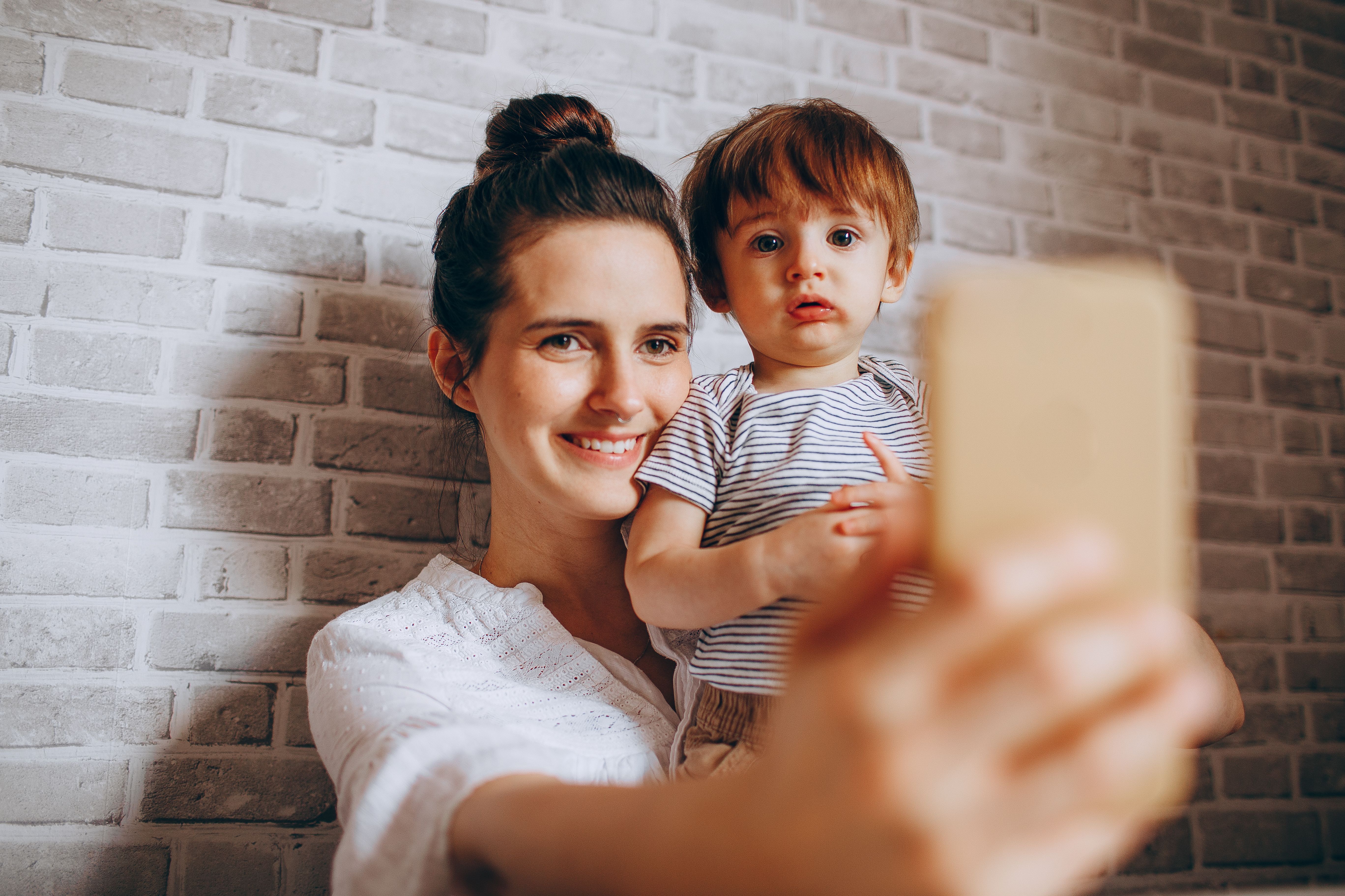 Mother taking a selfie with her child | Source: Pexels