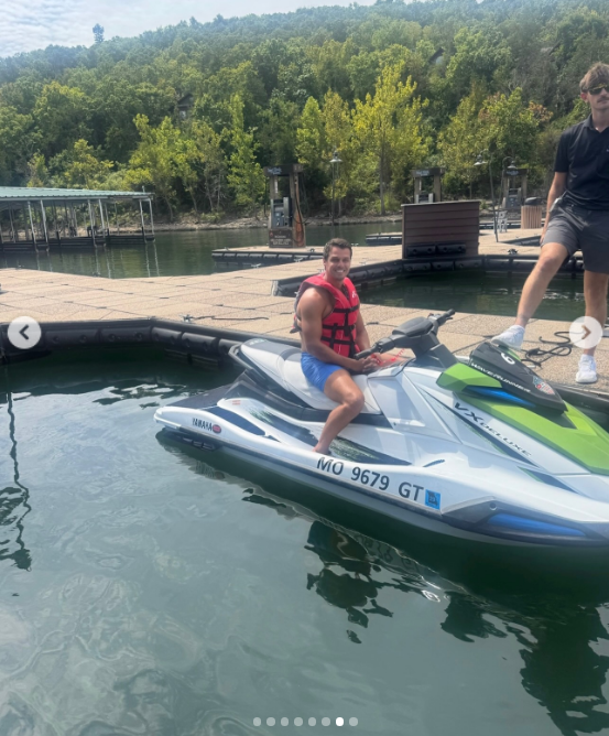 Soaking up the sun on a lake excursion, Brendan smiles from atop a personal watercraft in a life vest and swim shorts. Miranda's lighthearted birthday tribute showcased his fun, active spirit, drawing playful reactions from fans who celebrated how genuinely happy and relaxed the couple looks together. | Source: Instagram/mirandalambert