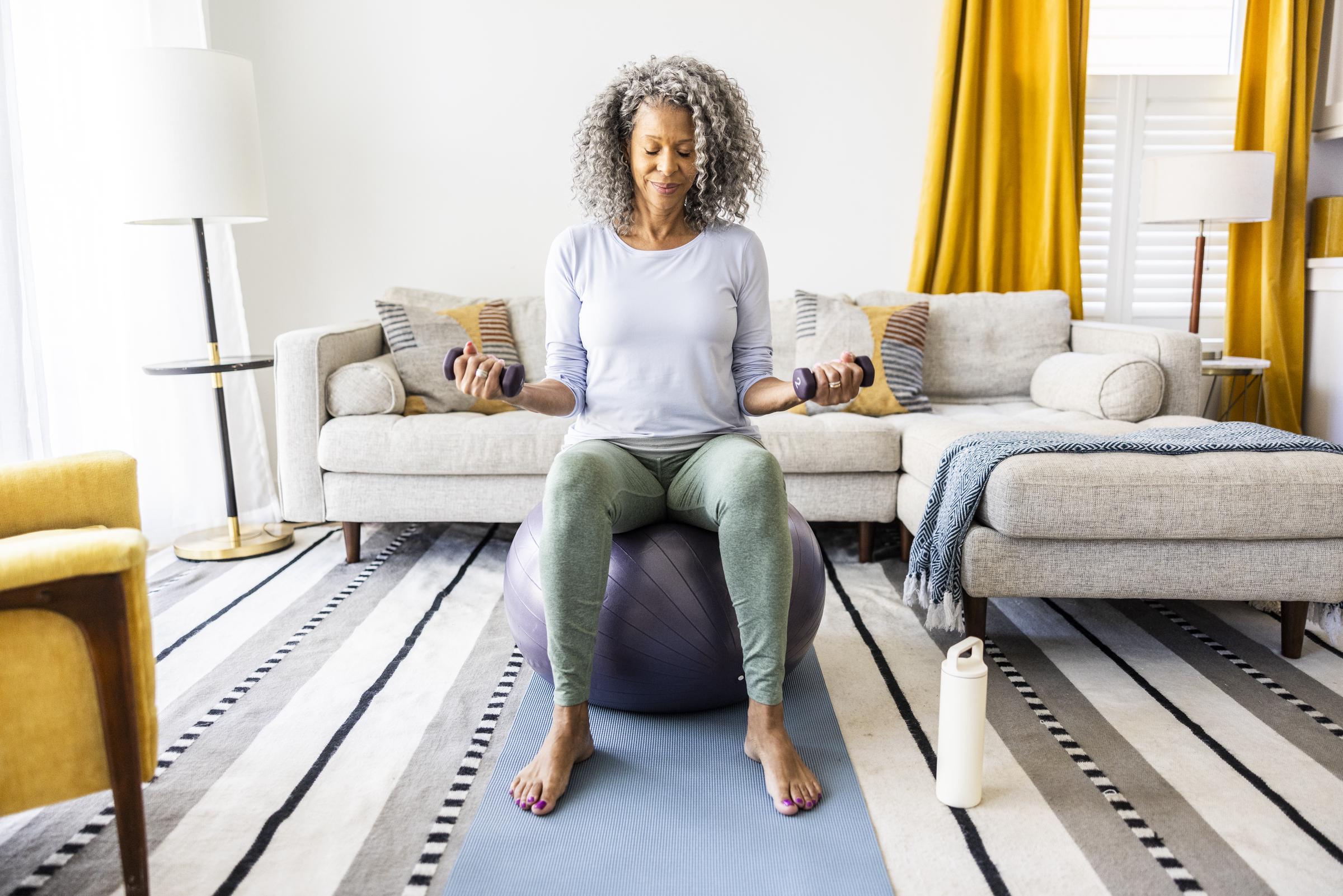 A woman working out at home | Source: Getty Images