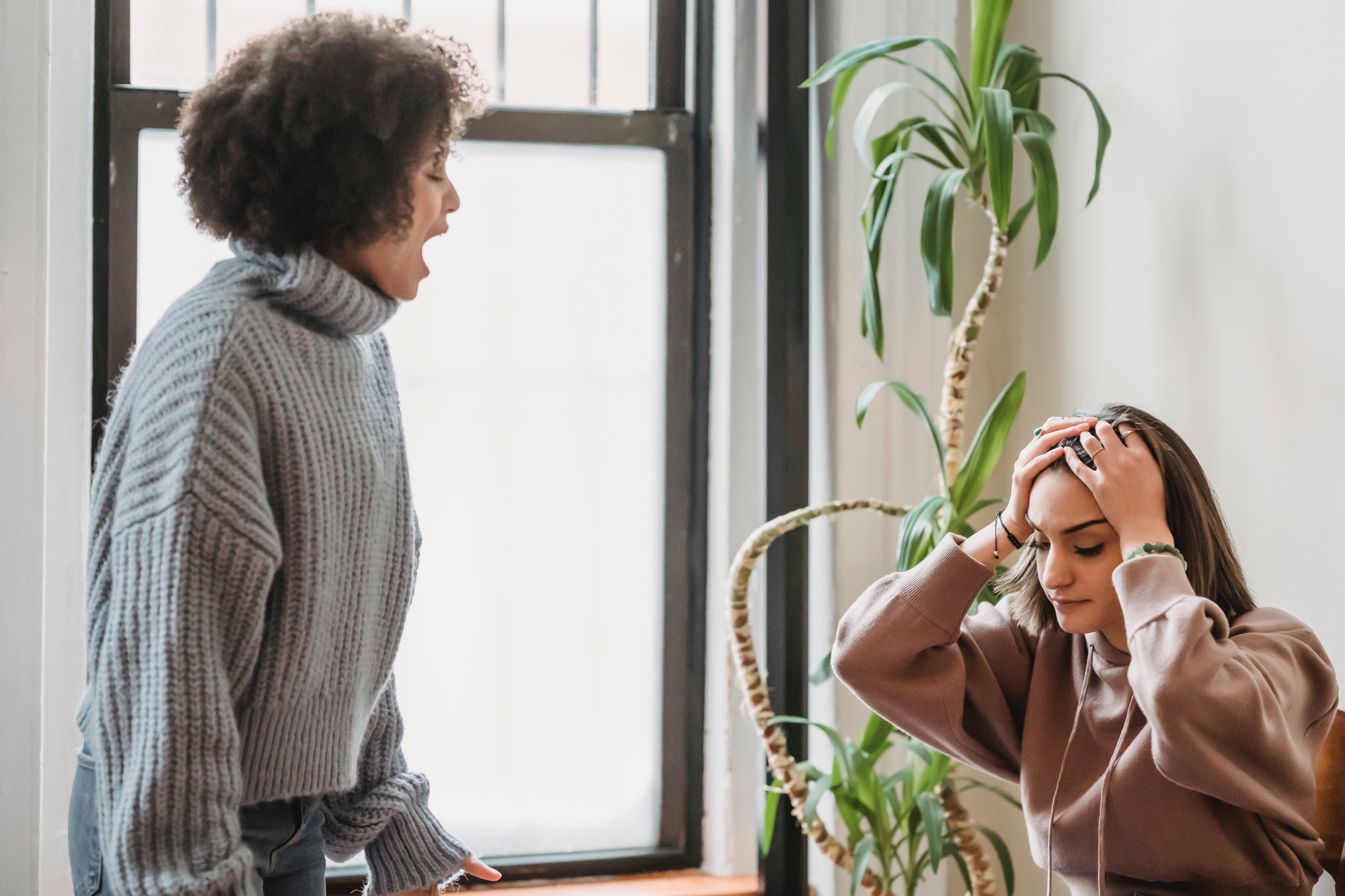 A woman frustrated by her friend screaming | Source: Pexels